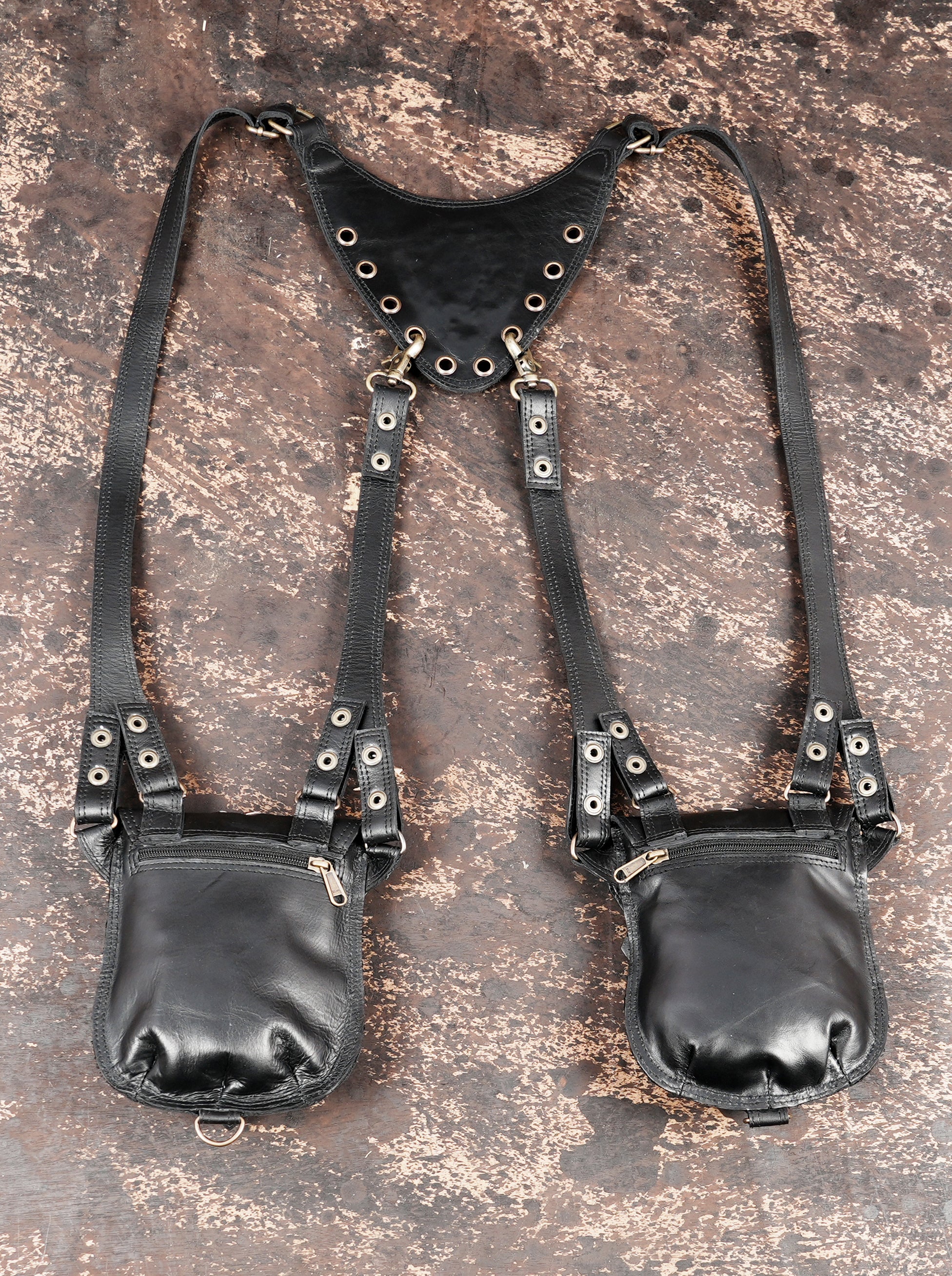 Adjustable leather shoulder rig with two small studded pouches