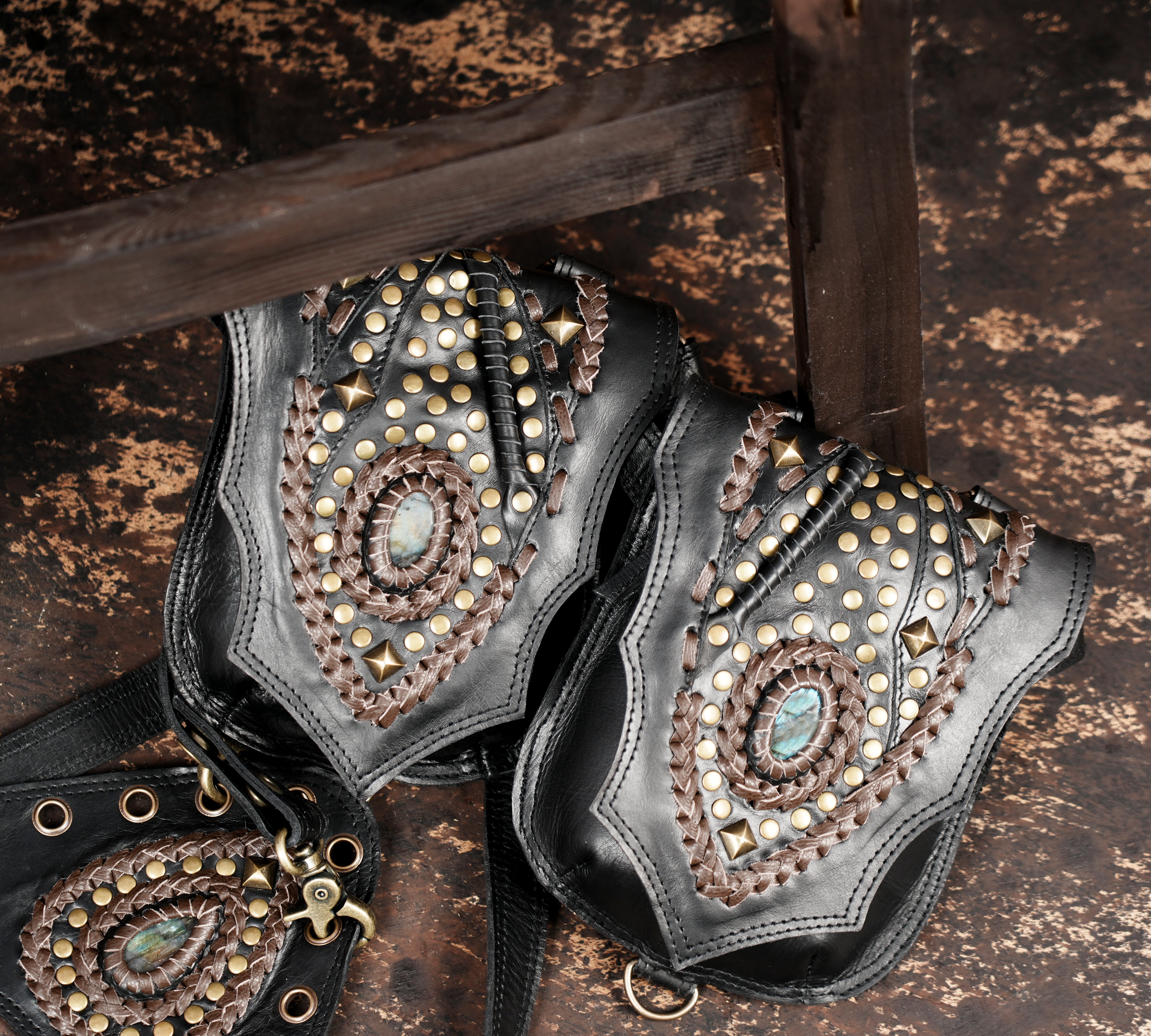 Decorative leather shoulder holster with adjustable straps and rivets