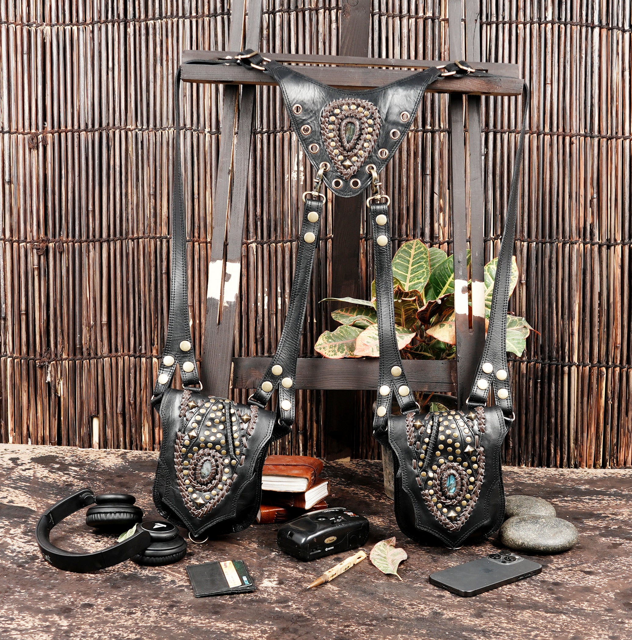 Leather chest holster bag with brass hardware and stud detailing