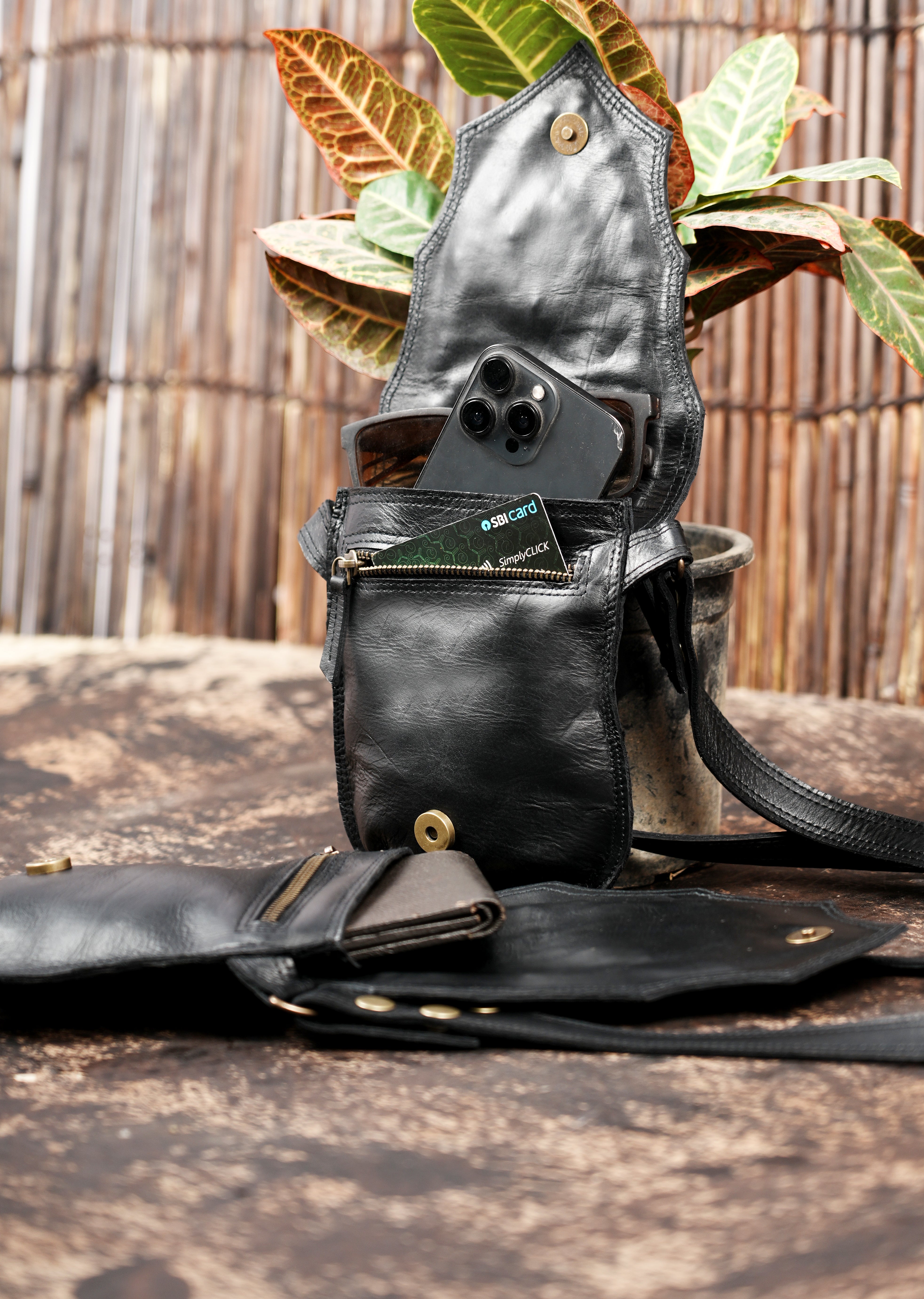 Rustic leather harness holster with ornamental metal accents