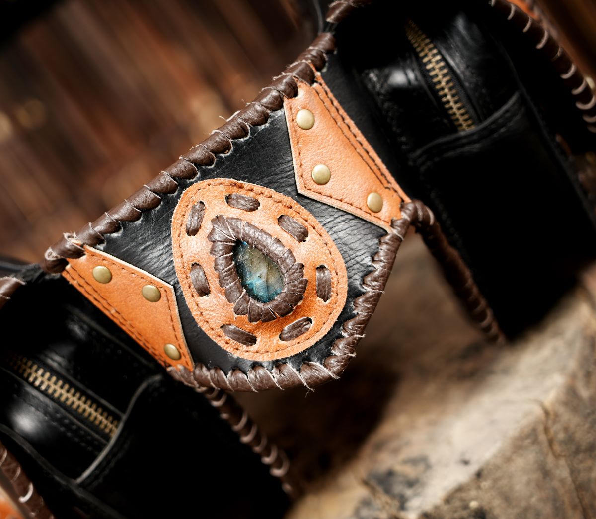 Rustic hand-stitched leather belt bag with stone embellishments