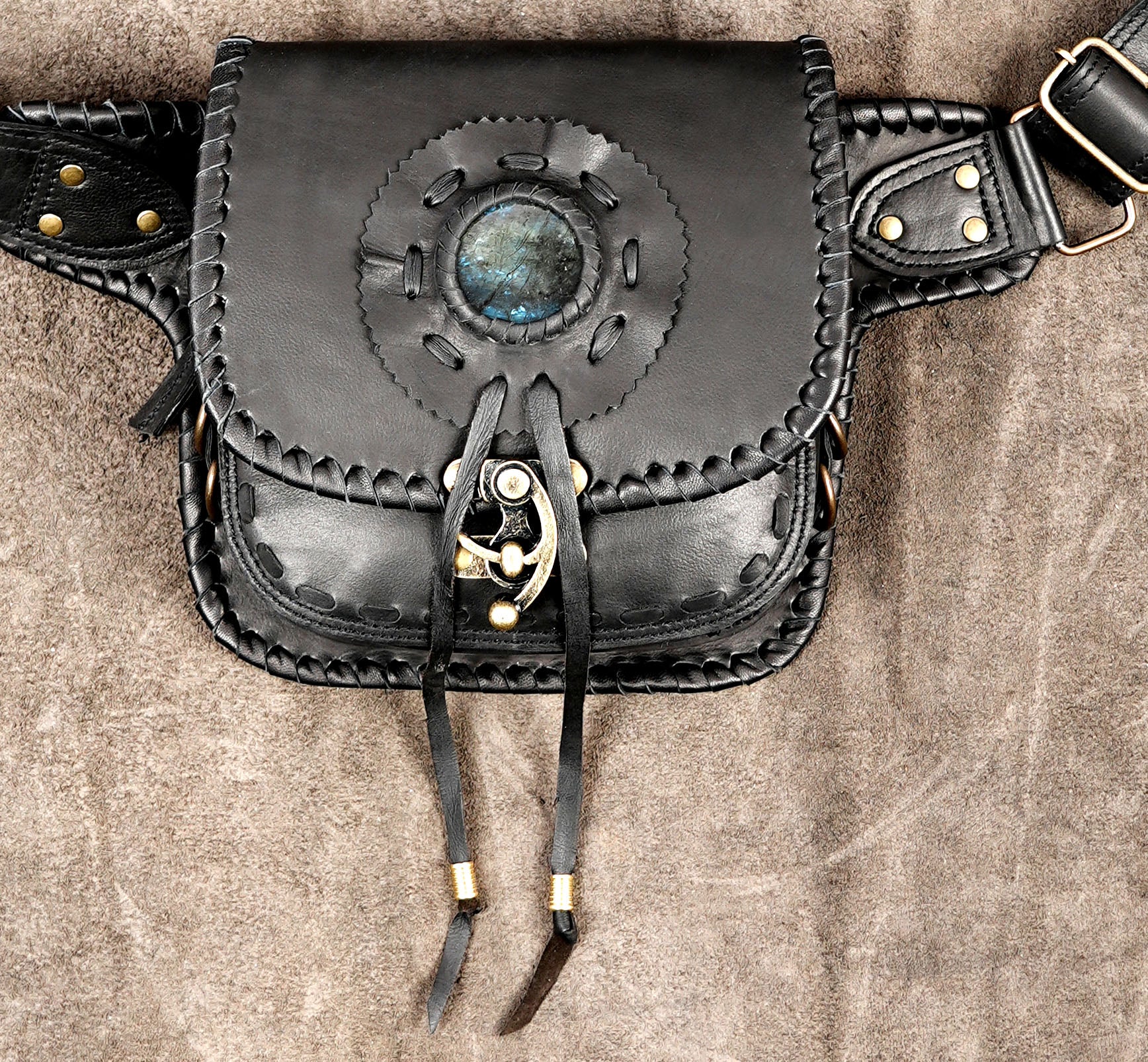 Handmade leather hip bag with brass hardware