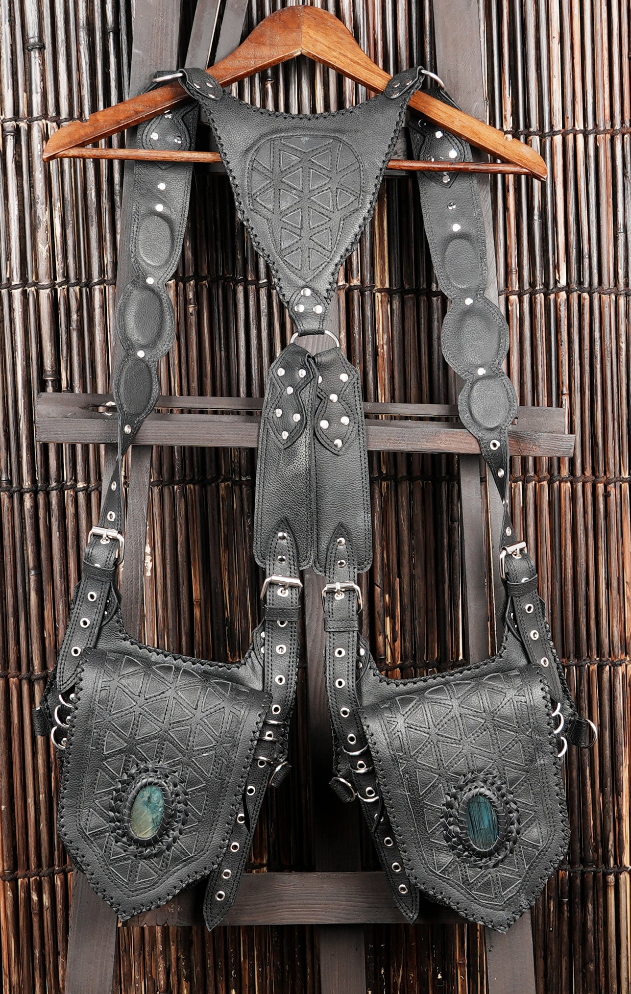 Tribal style leather shoulder holster with hand stitched edging