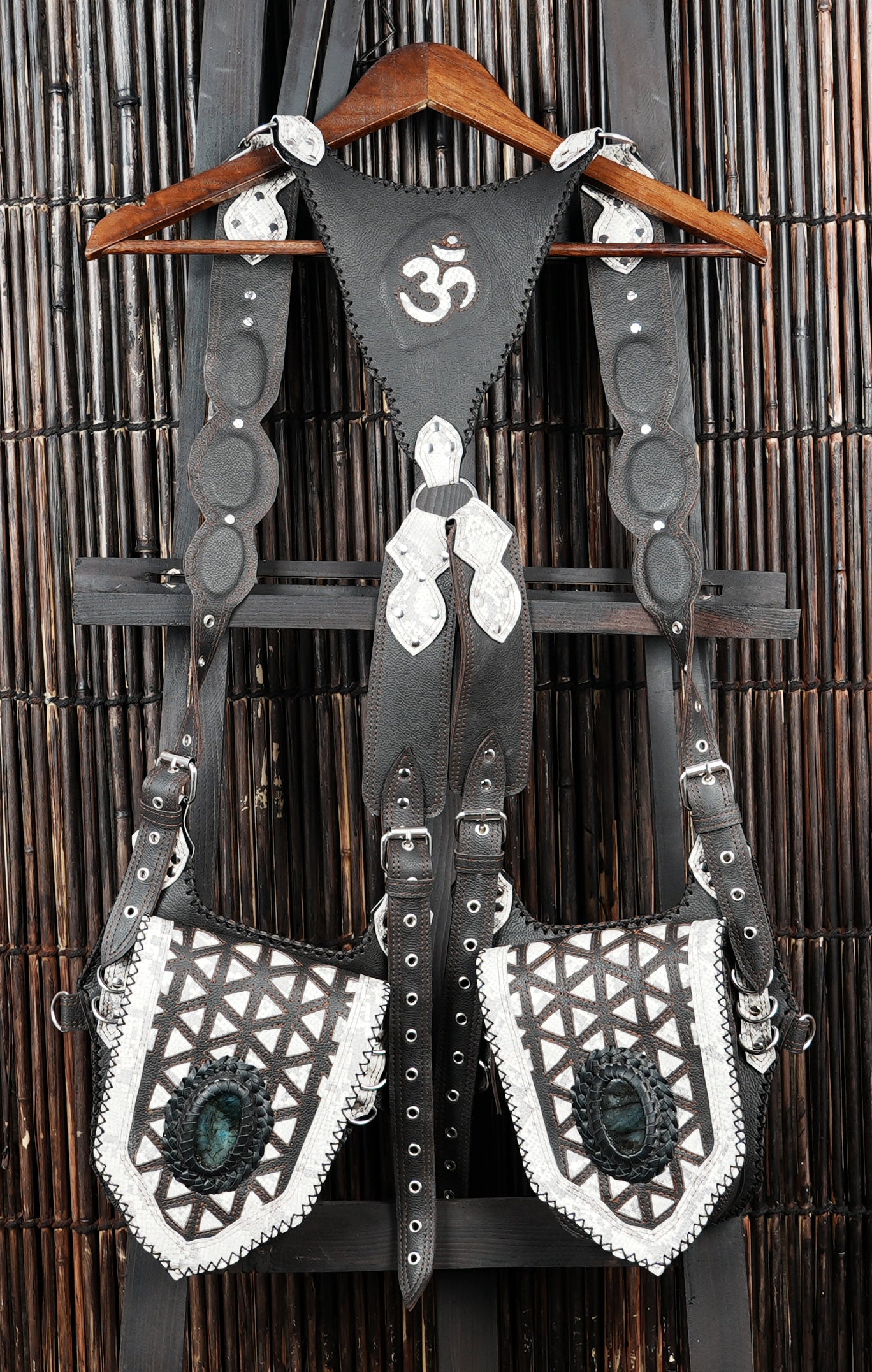 Decorative leather holster rig with symmetrical pouch layout and Om motif