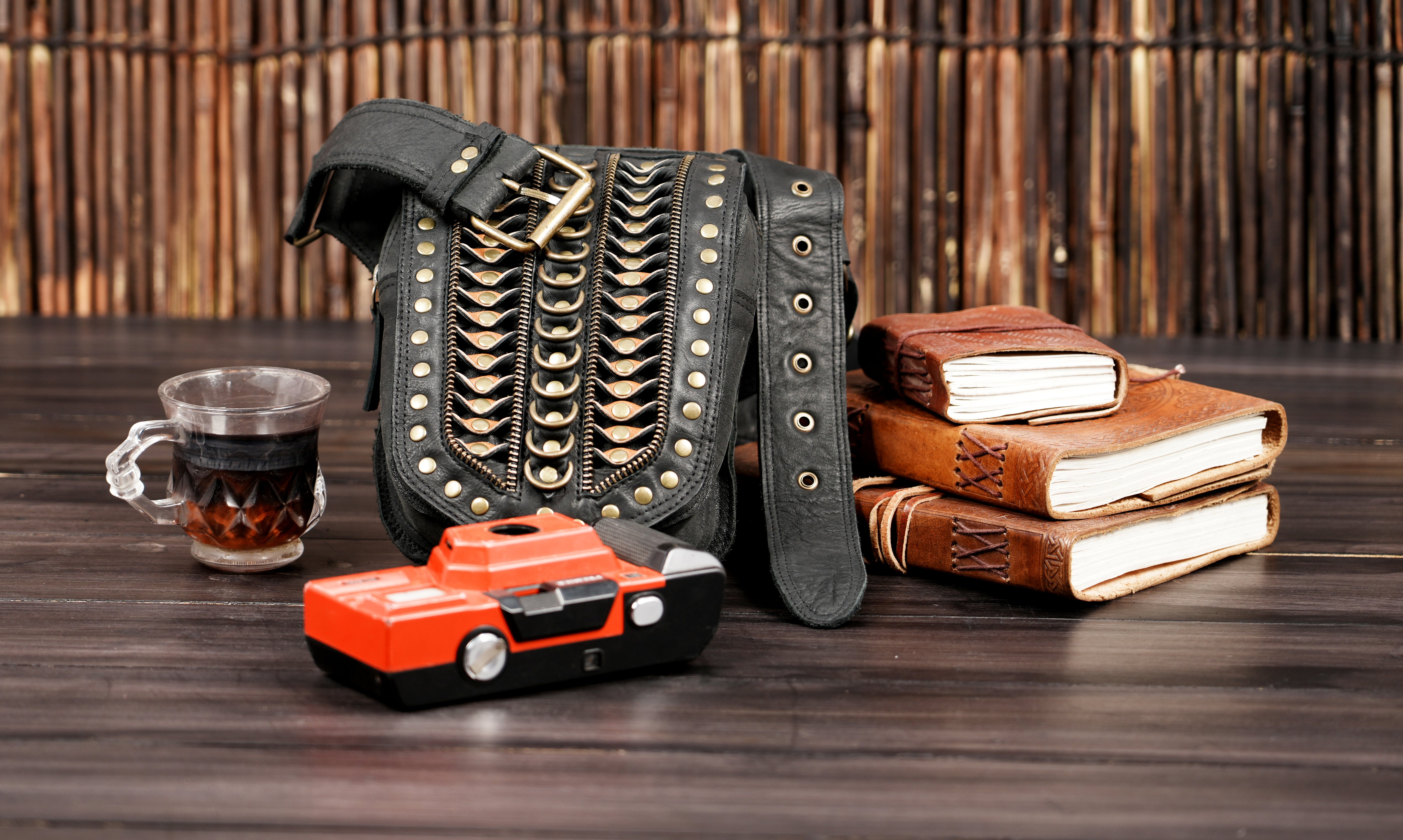 Designer leather waist belt with metal studs and secure buckle closure