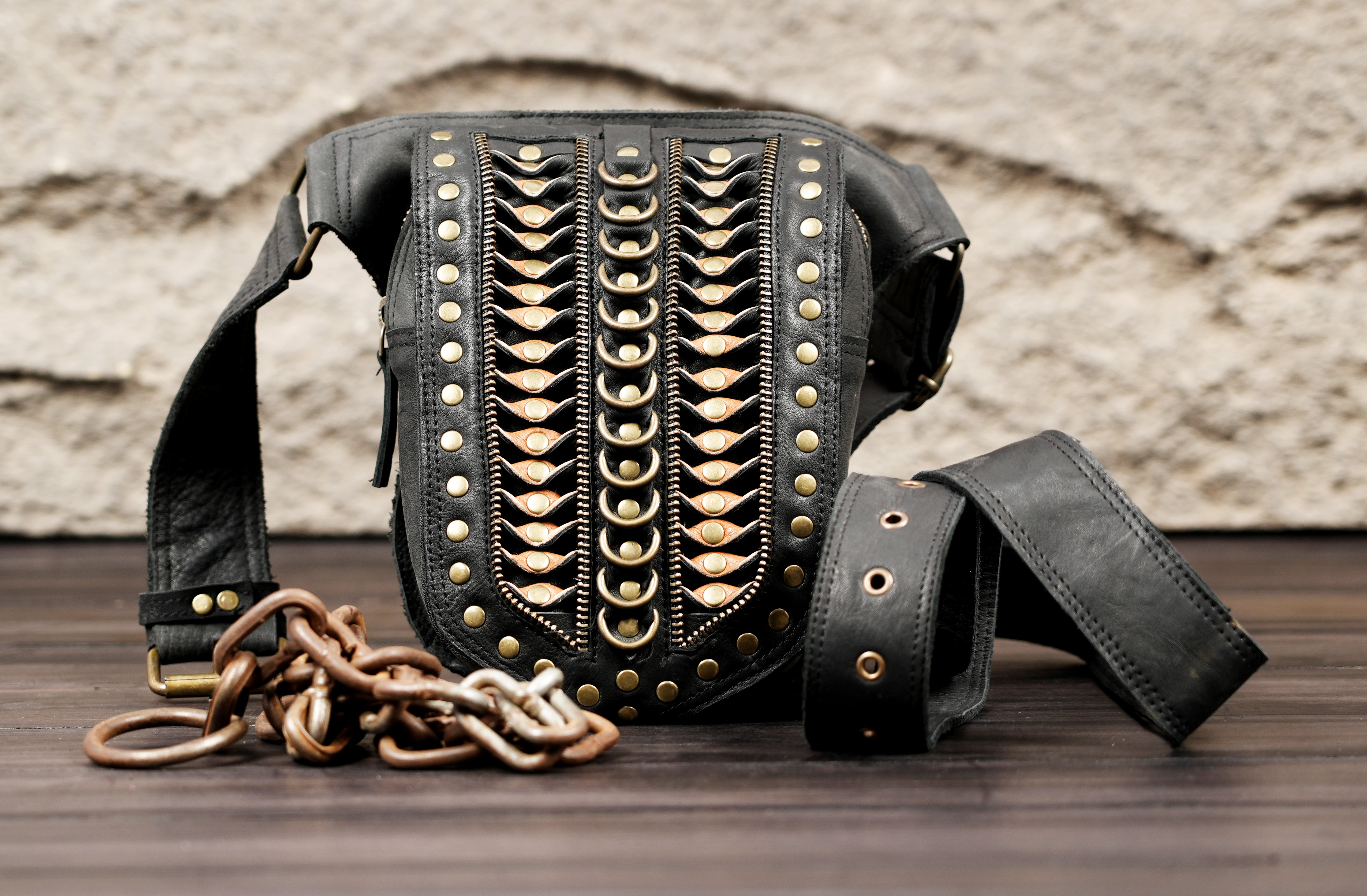 Black leather waist belt with decorative chains and studded front pouch