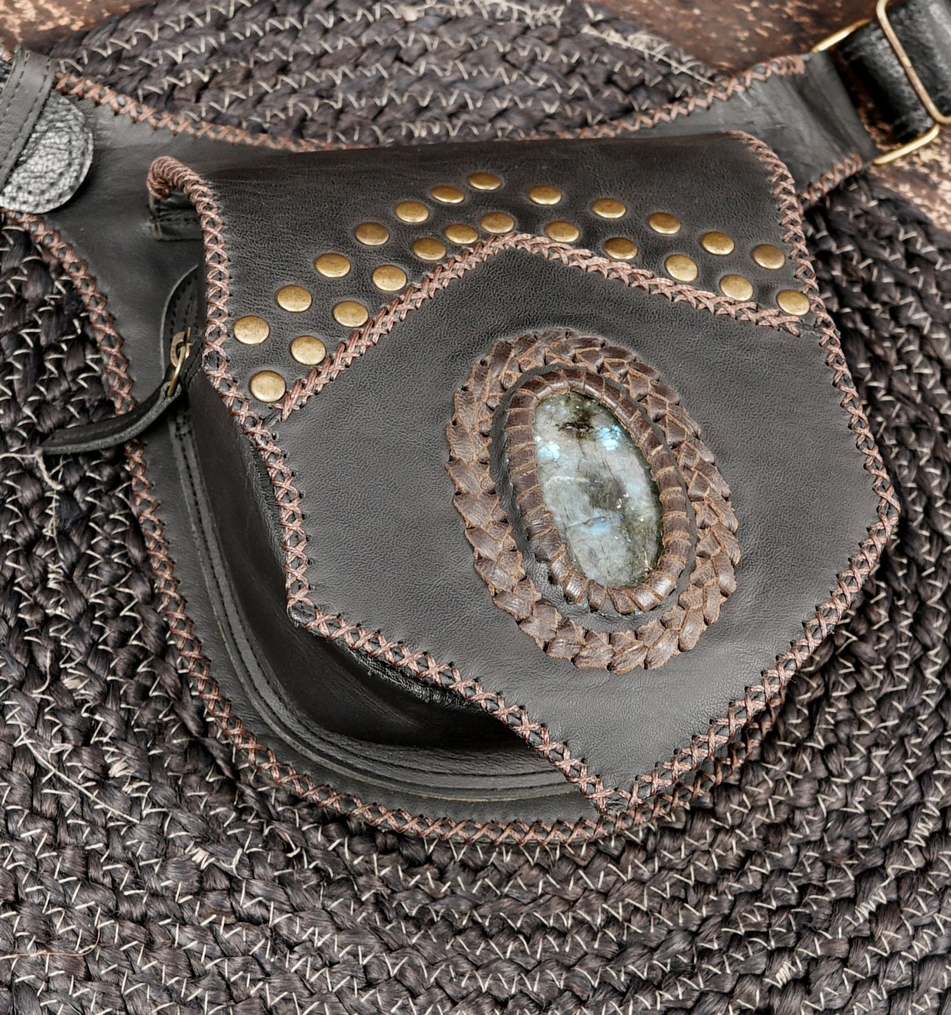 Artisan leather utility belt with woven texture and stud accents