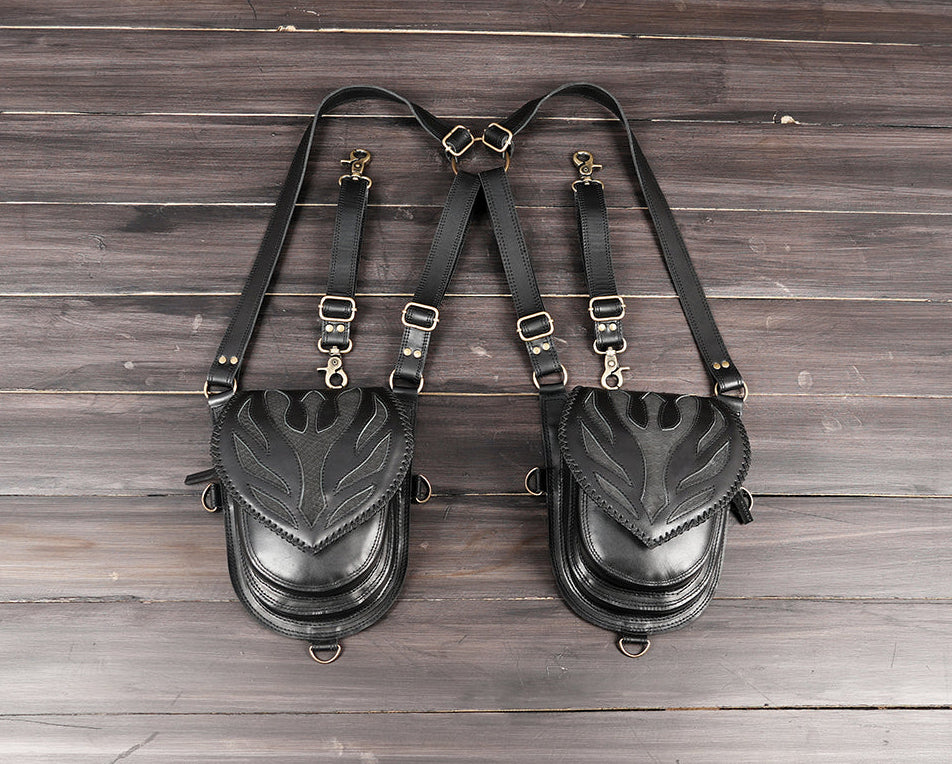 Black leather thigh holster bag with adjustable straps and metal buckles