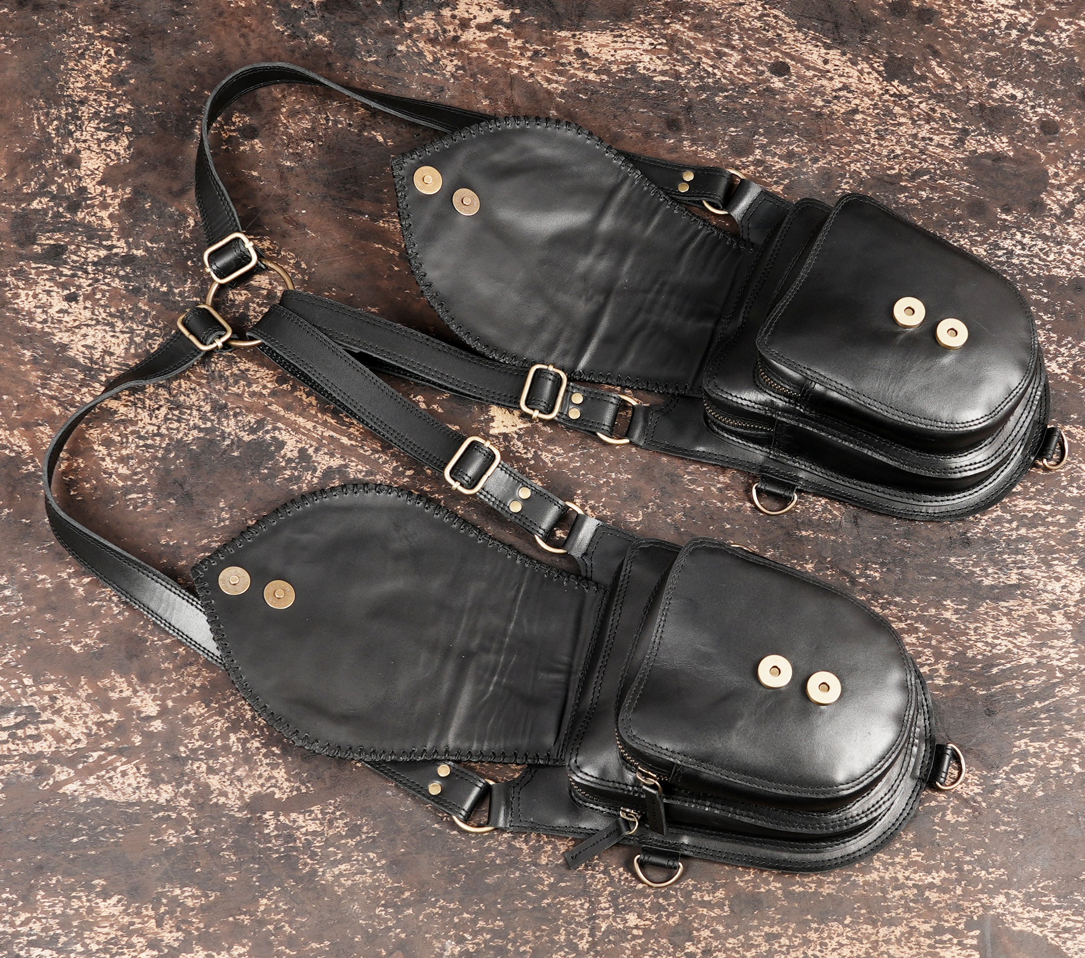Leather utility holster bag with metal clasps and rings