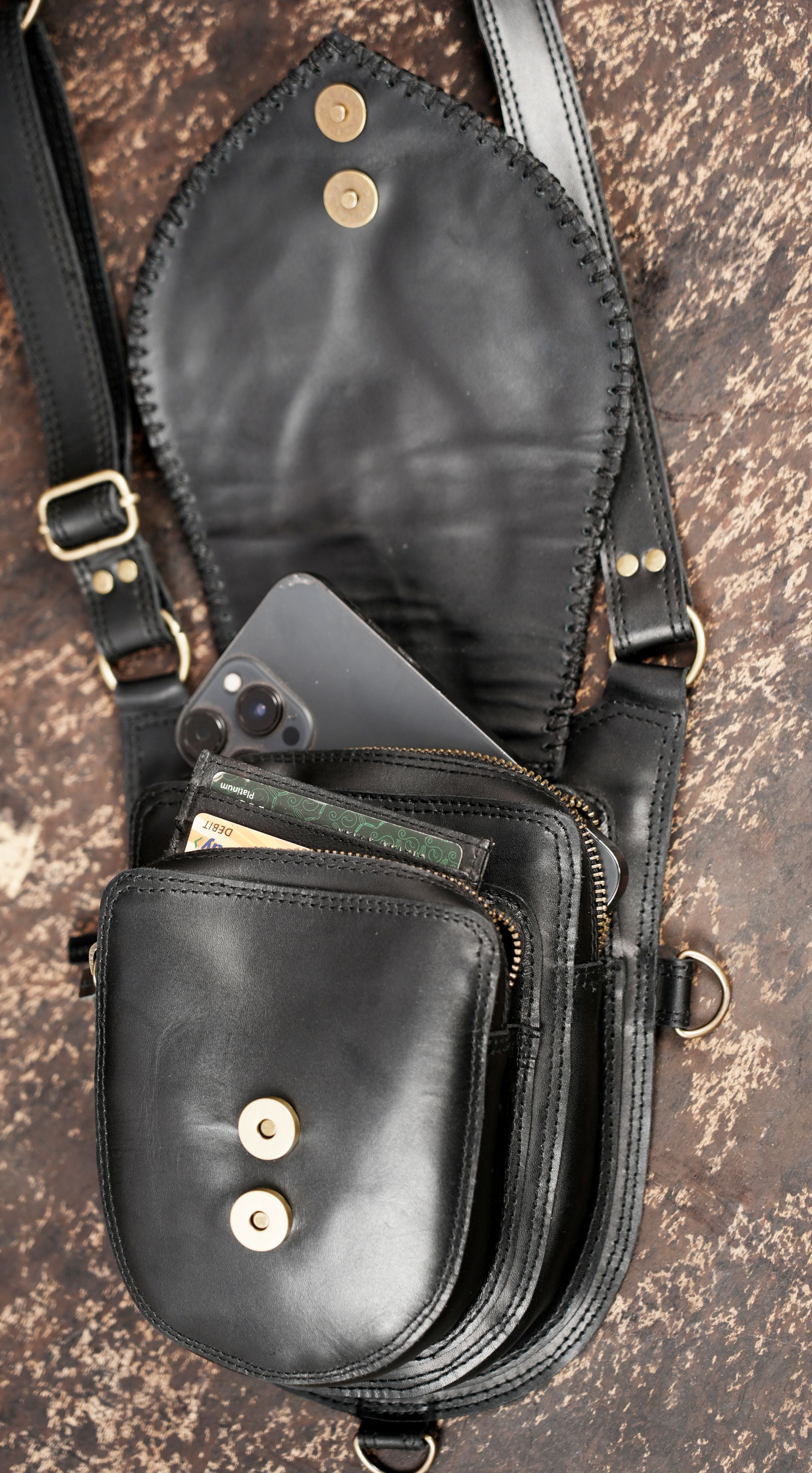 Handmade leather thigh bag with secure buckle closures