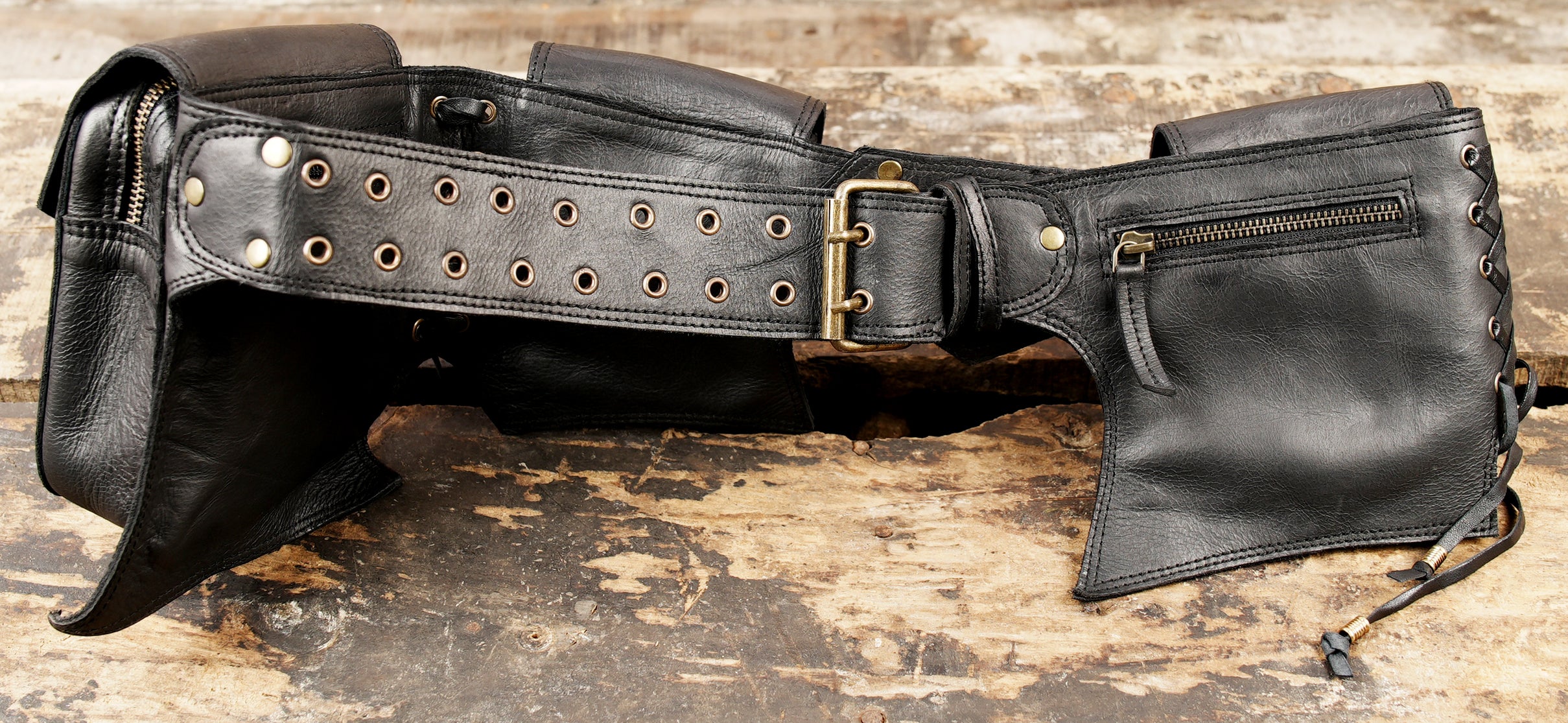 Adjustable black leather pocket belt for festival wear.