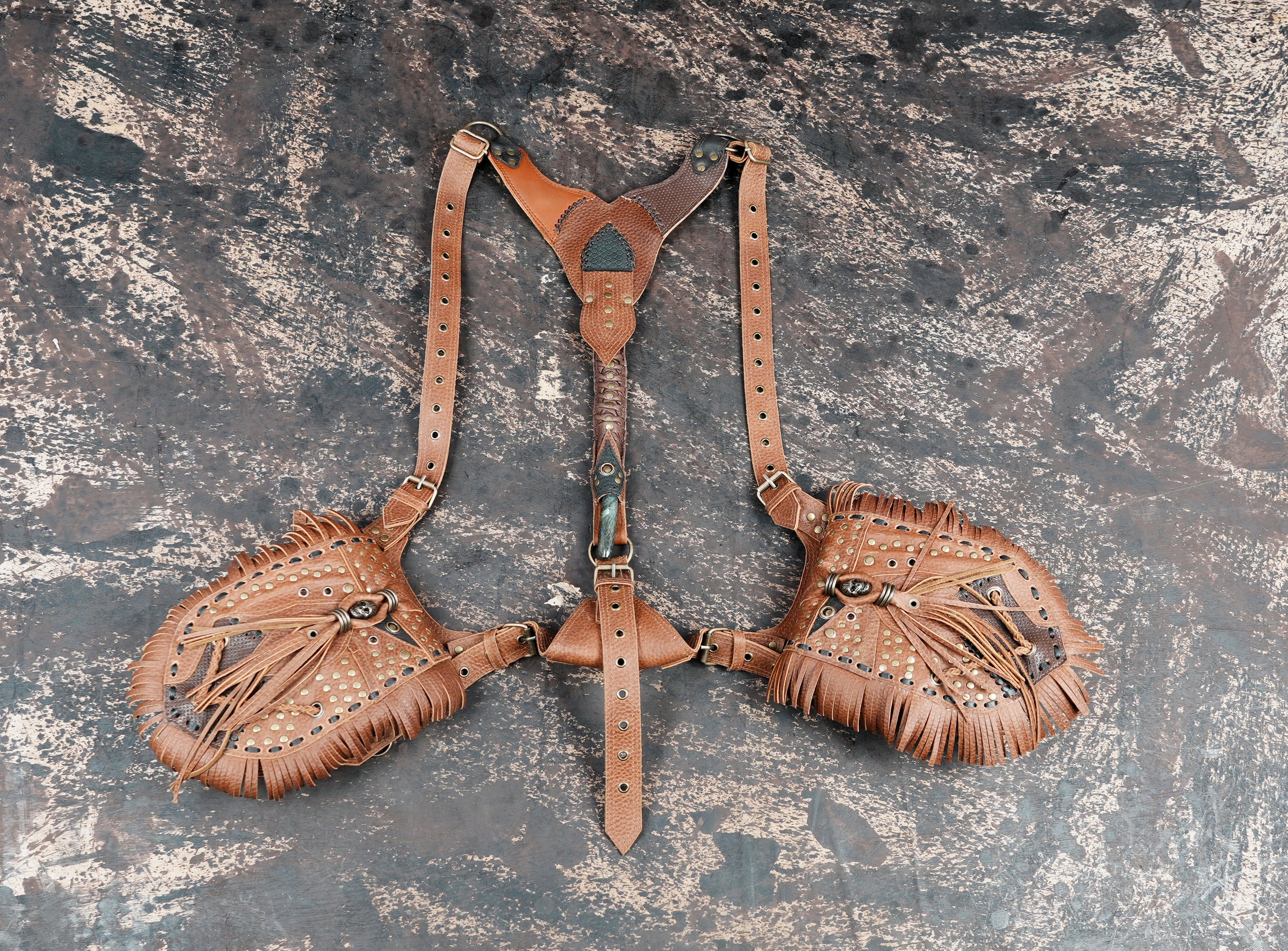 Brown leather dual holster bag with adjustable shoulder harness