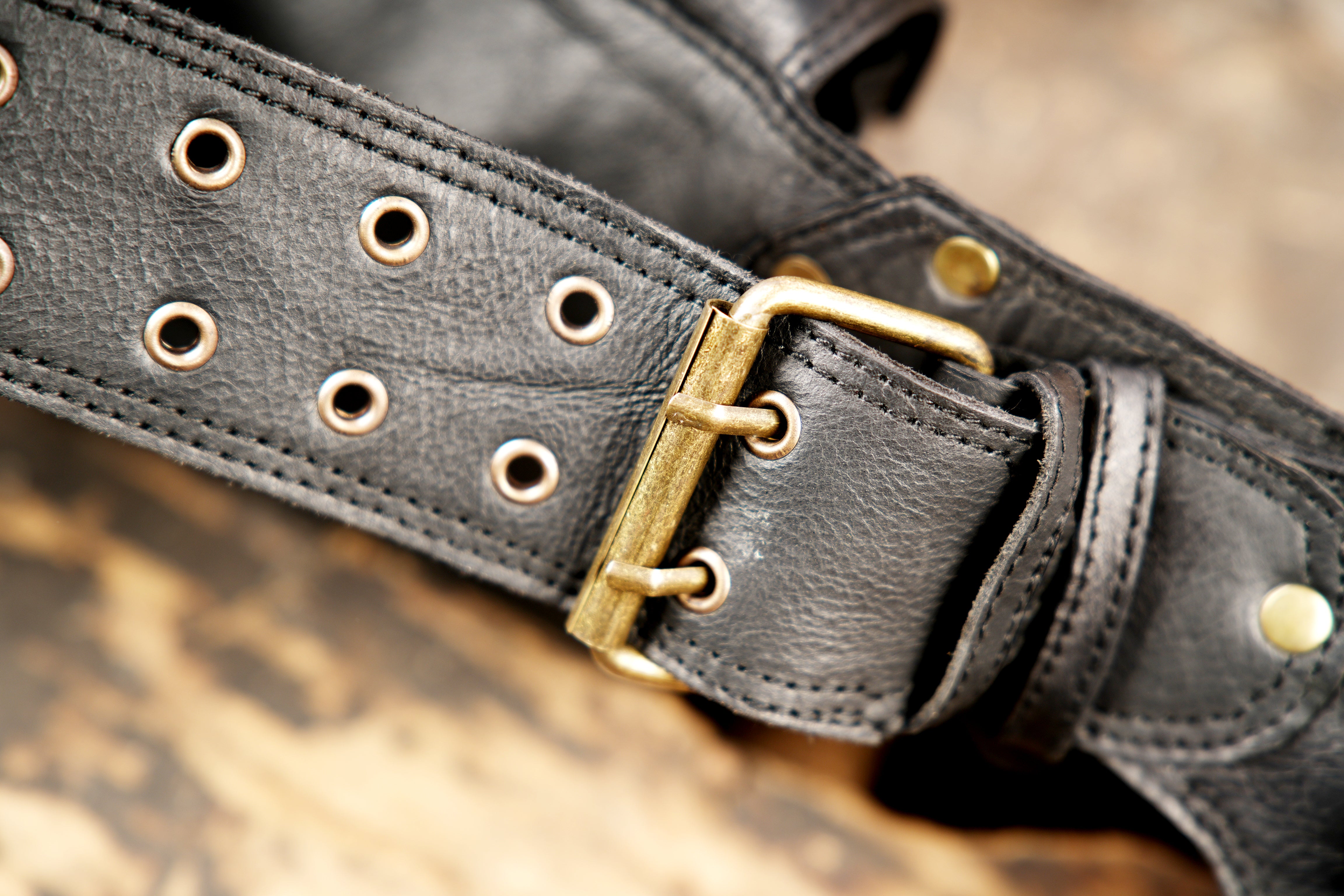 Adjustable black leather pocket belt for festival wear.