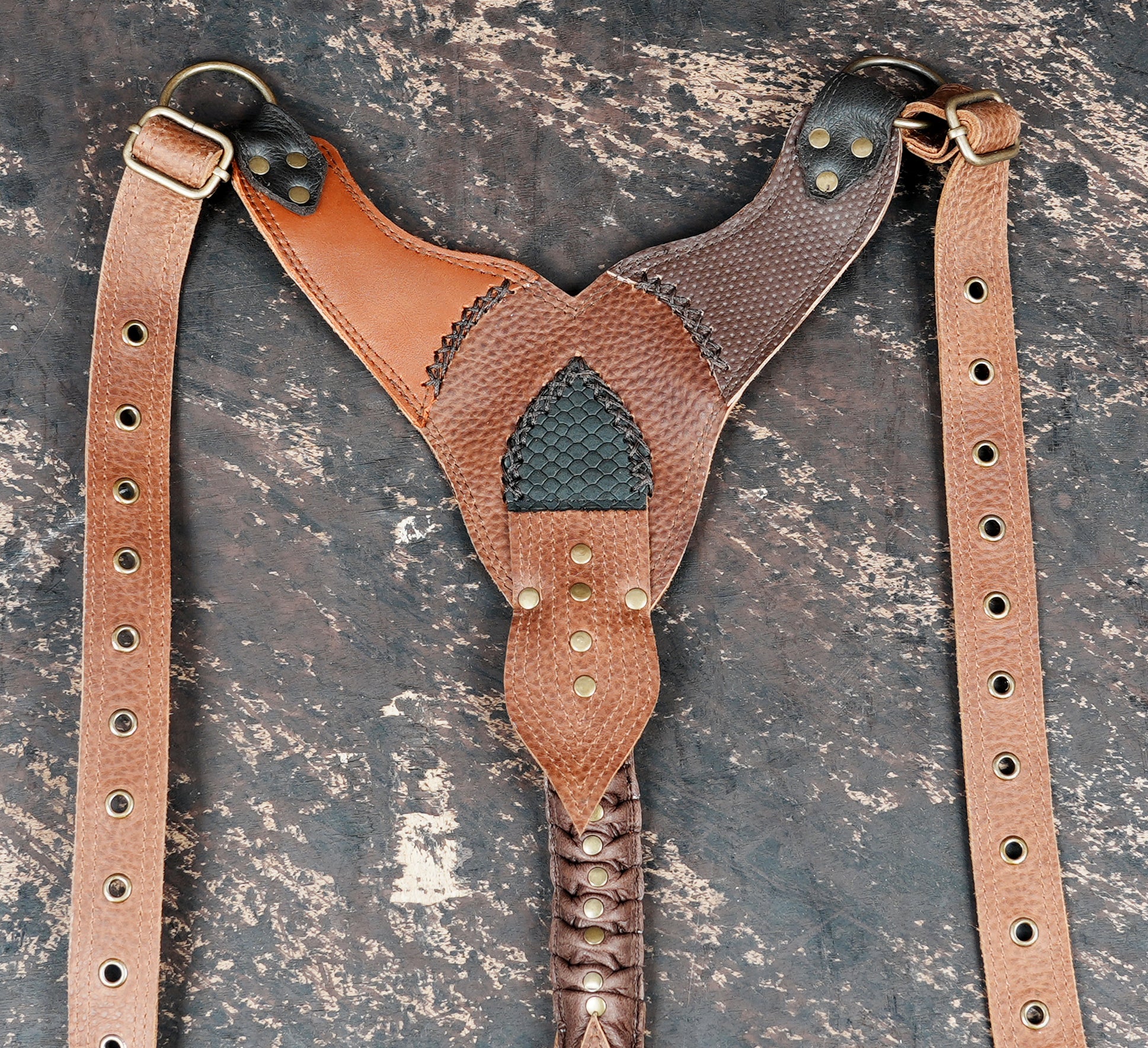 Handmade leather holster set with fringe detailing and metal studs