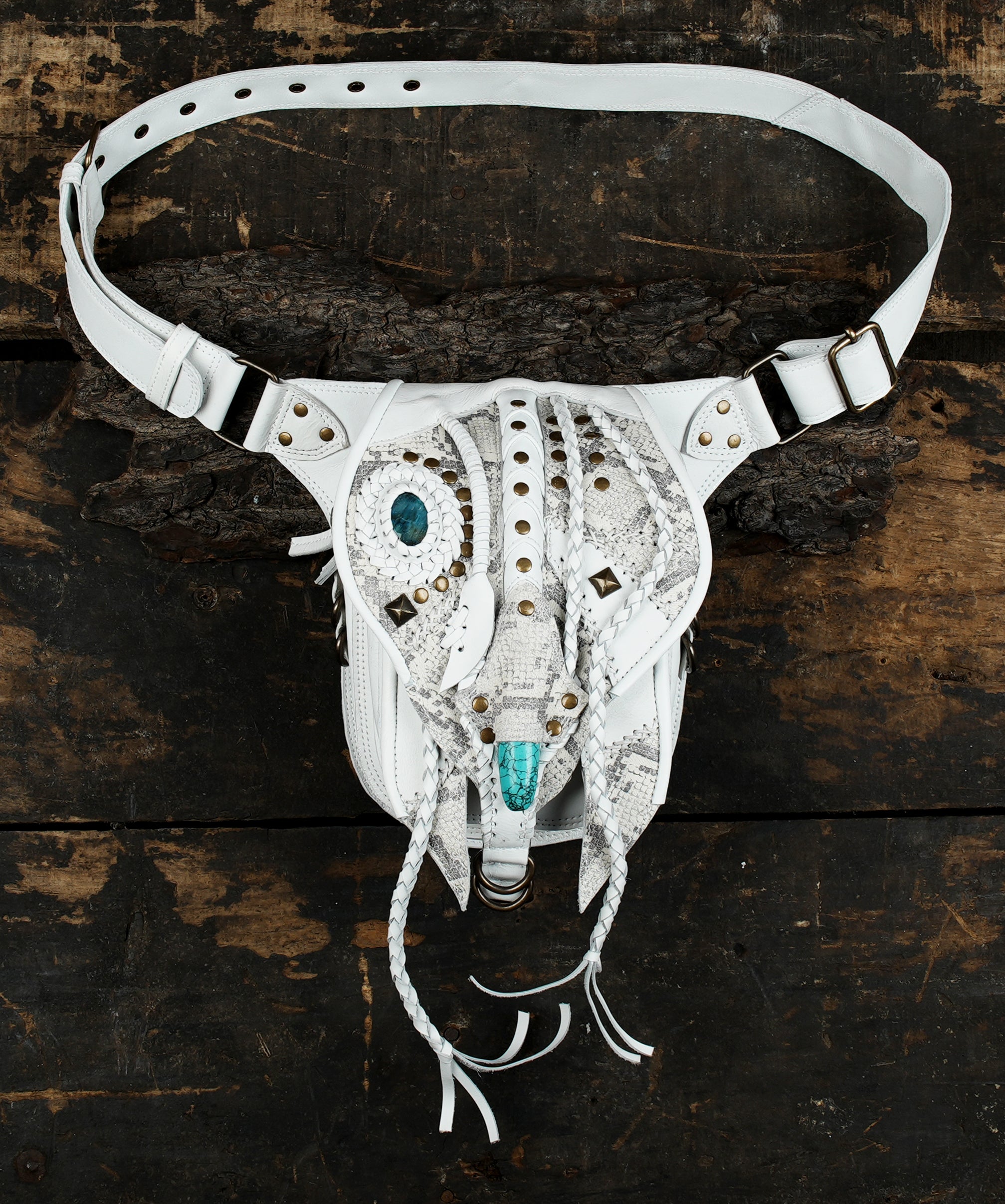 "Decorative handmade leather belt pouch with mixed textures"