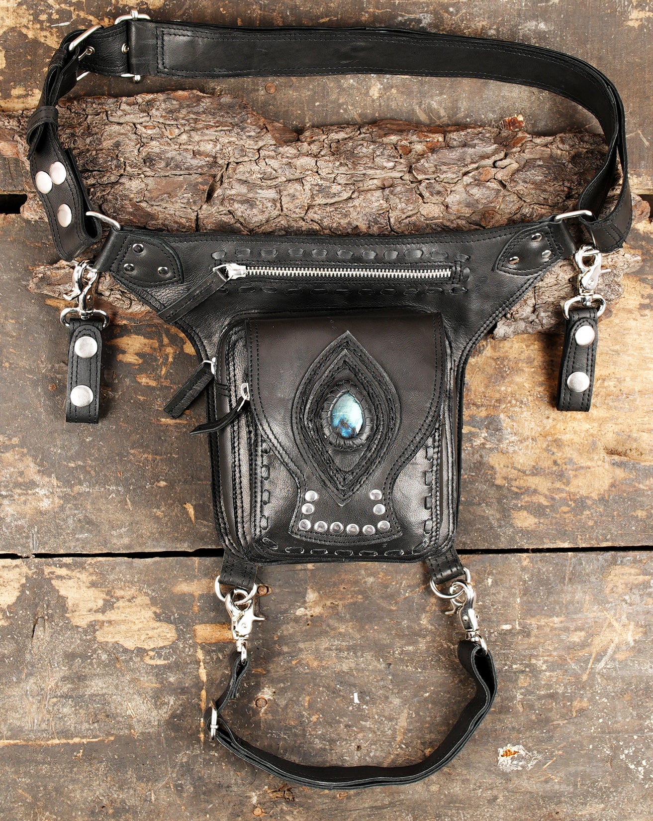 Brown leather thigh belt bag with metal hardware accents