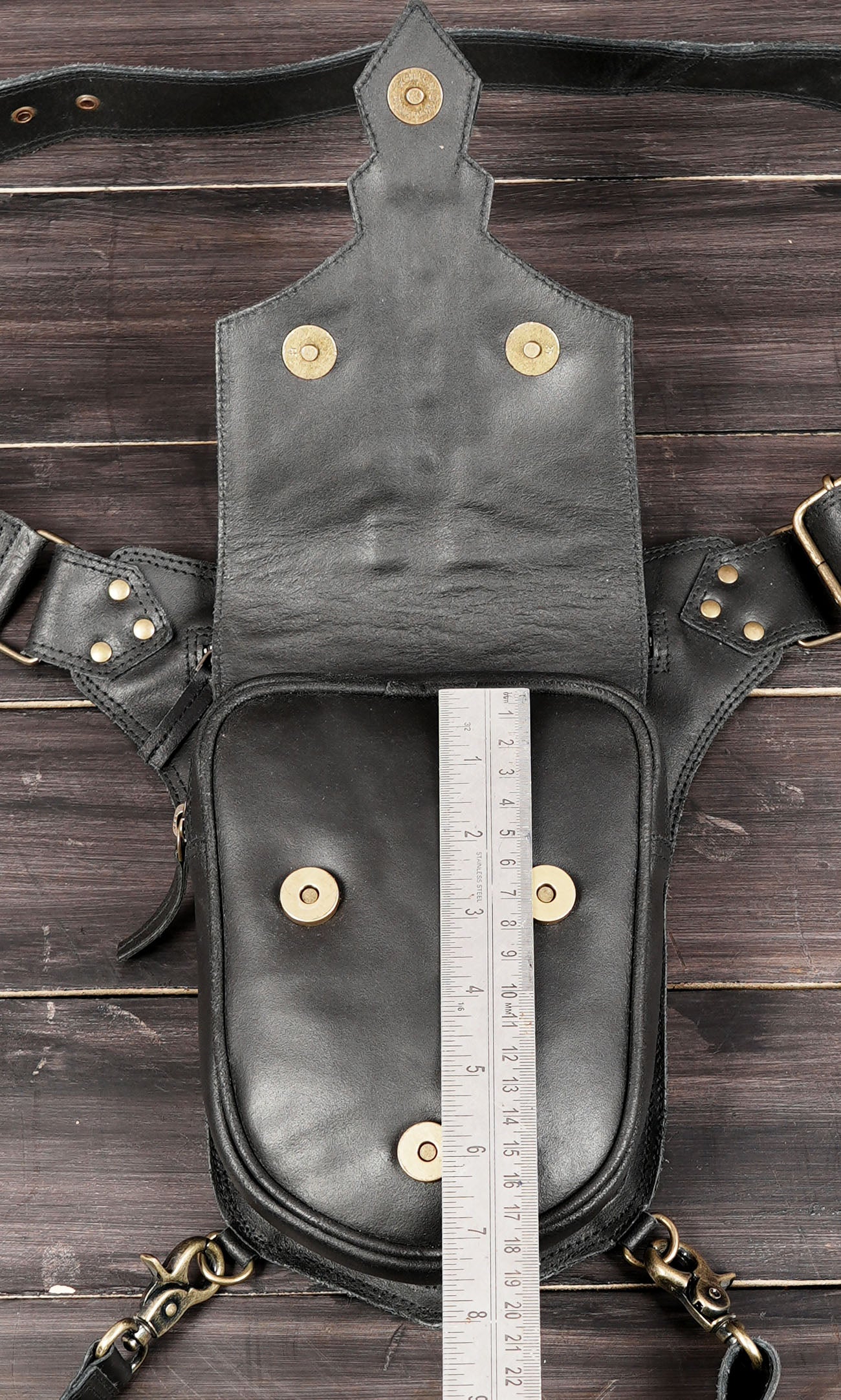 Black leather utility belt with thigh strap design