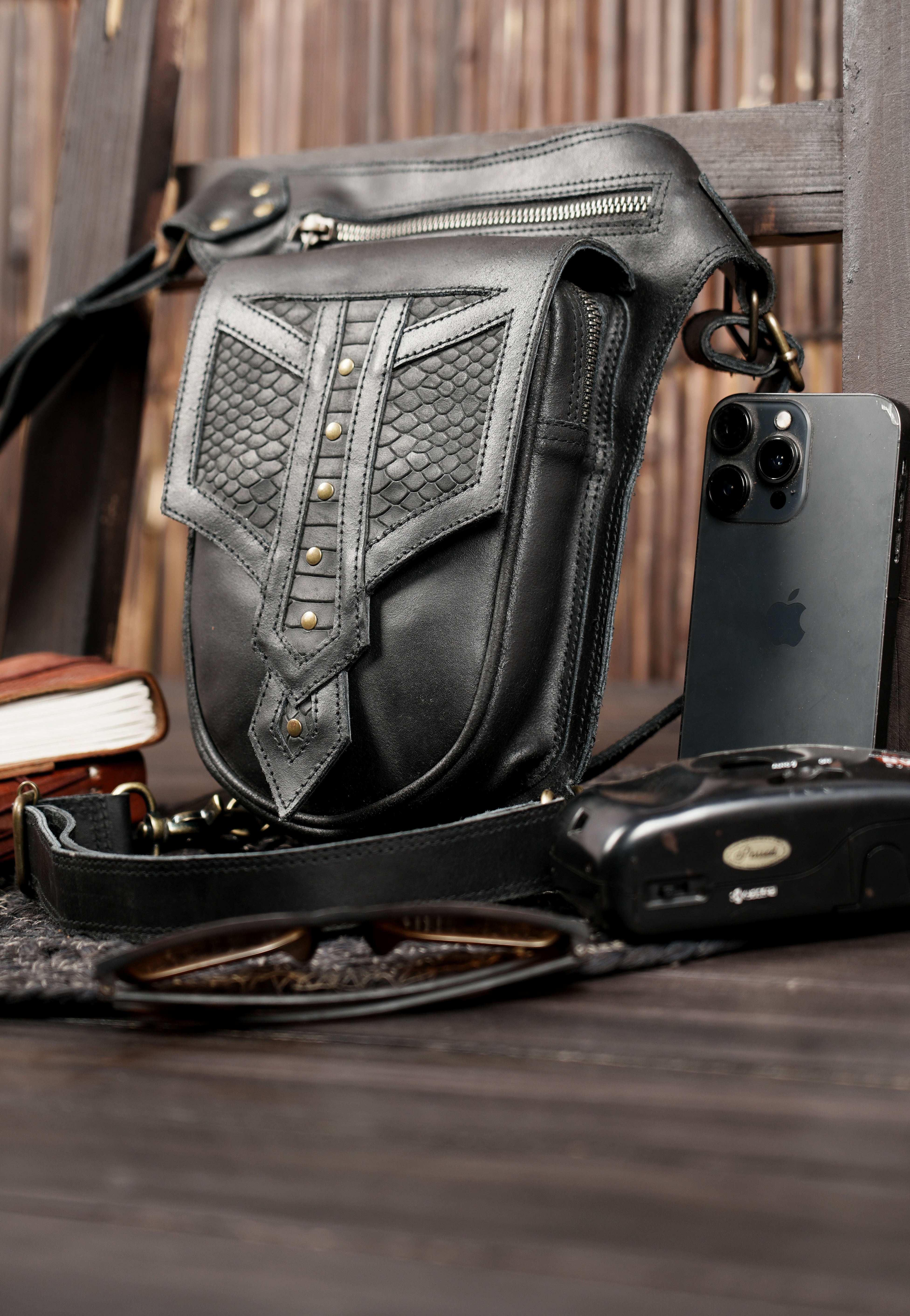 Black leather thigh belt bag with textured leather detail