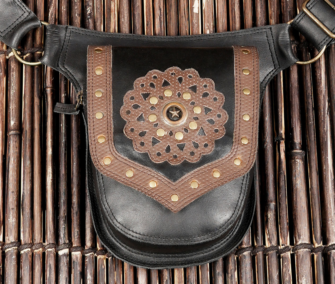 Black leather waist belt with adjustable strap and secure buckle