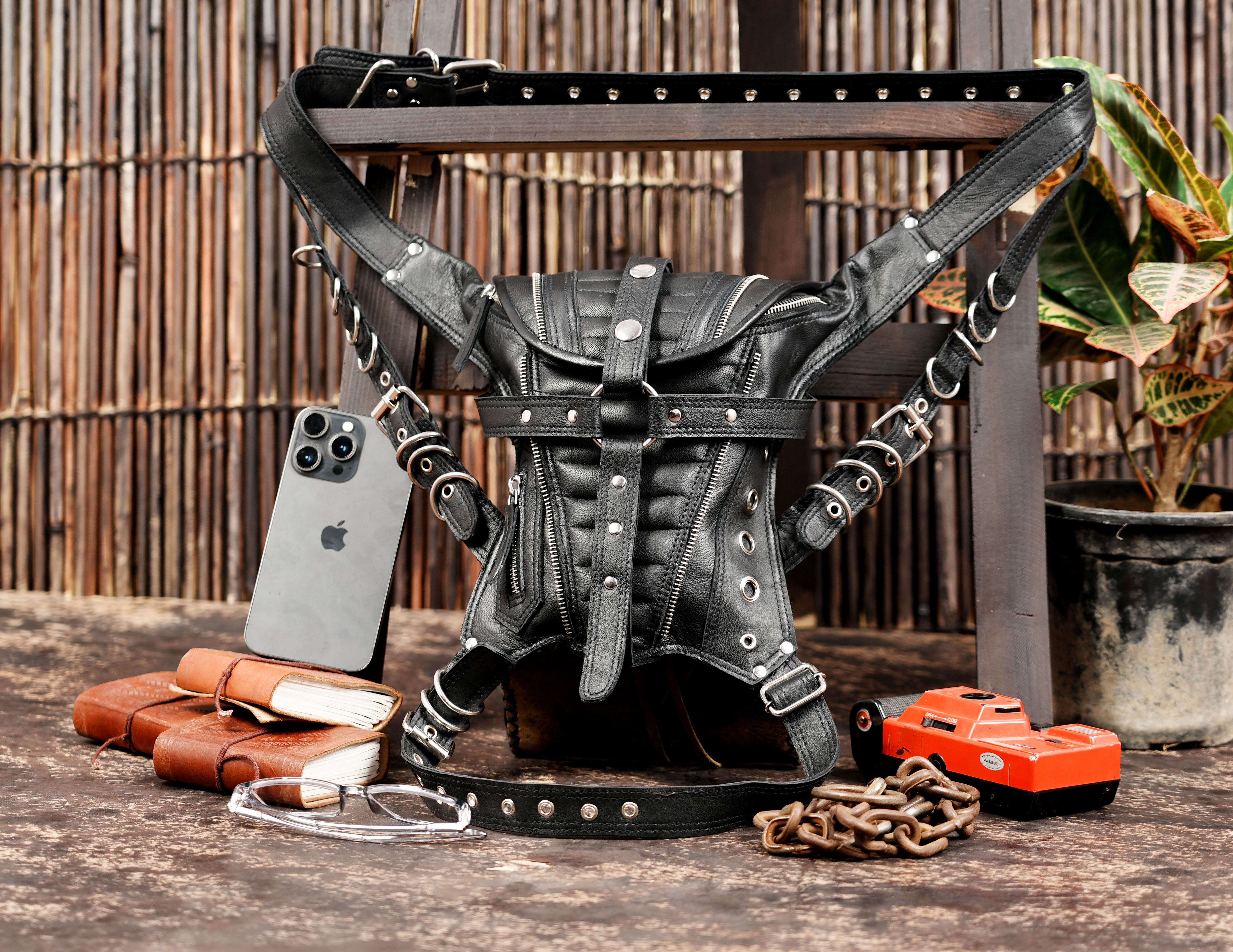 Handcrafted black leather thigh belt with strong buckle closure