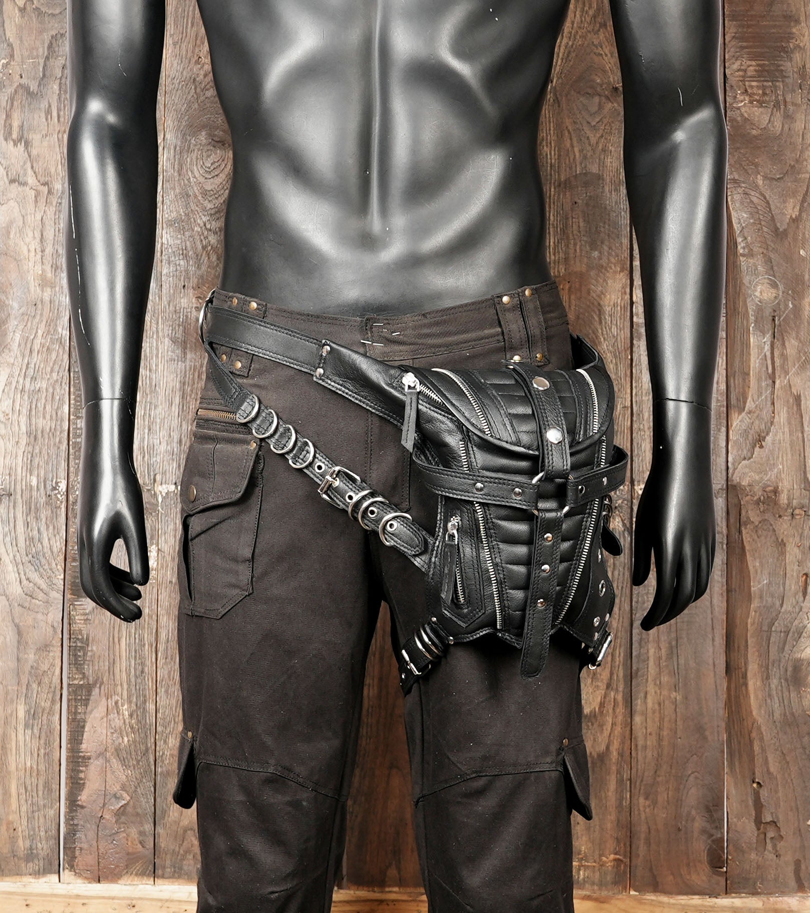 Heavy duty leather thigh belt with reinforced rivets and buckles