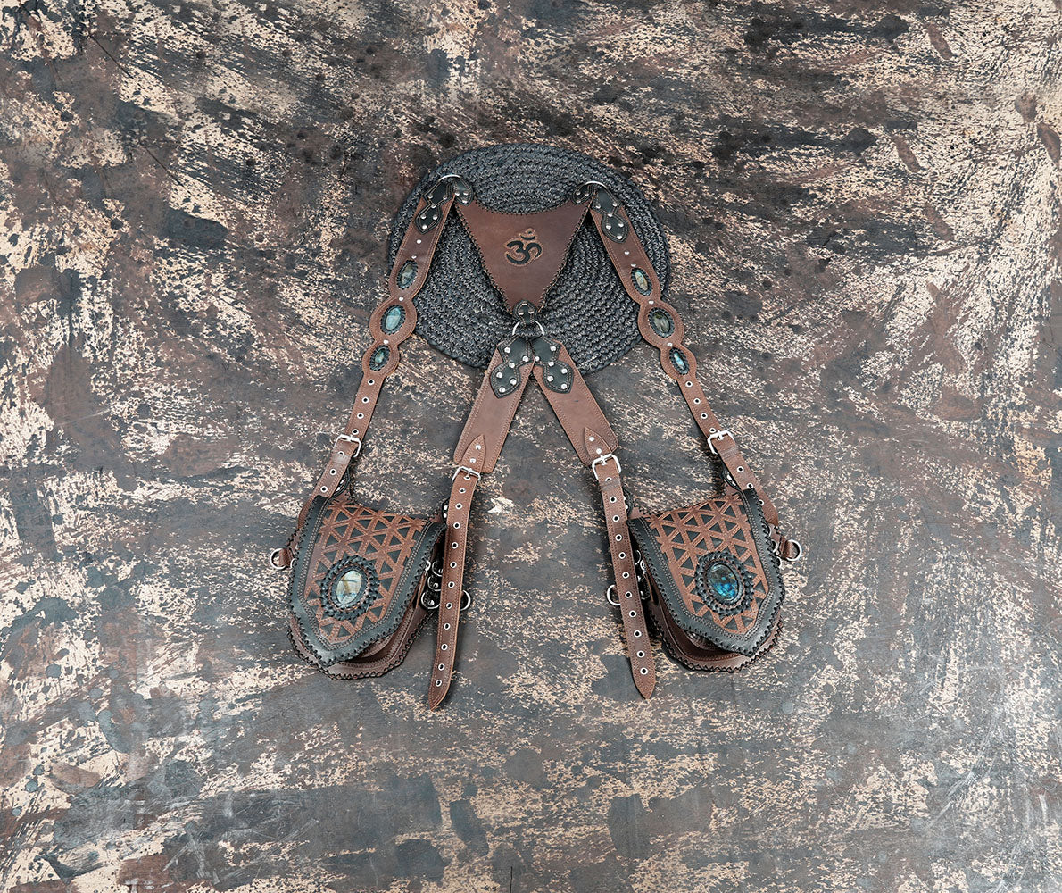 Handmade brown leather shoulder holster with adjustable straps and gemstone detailing