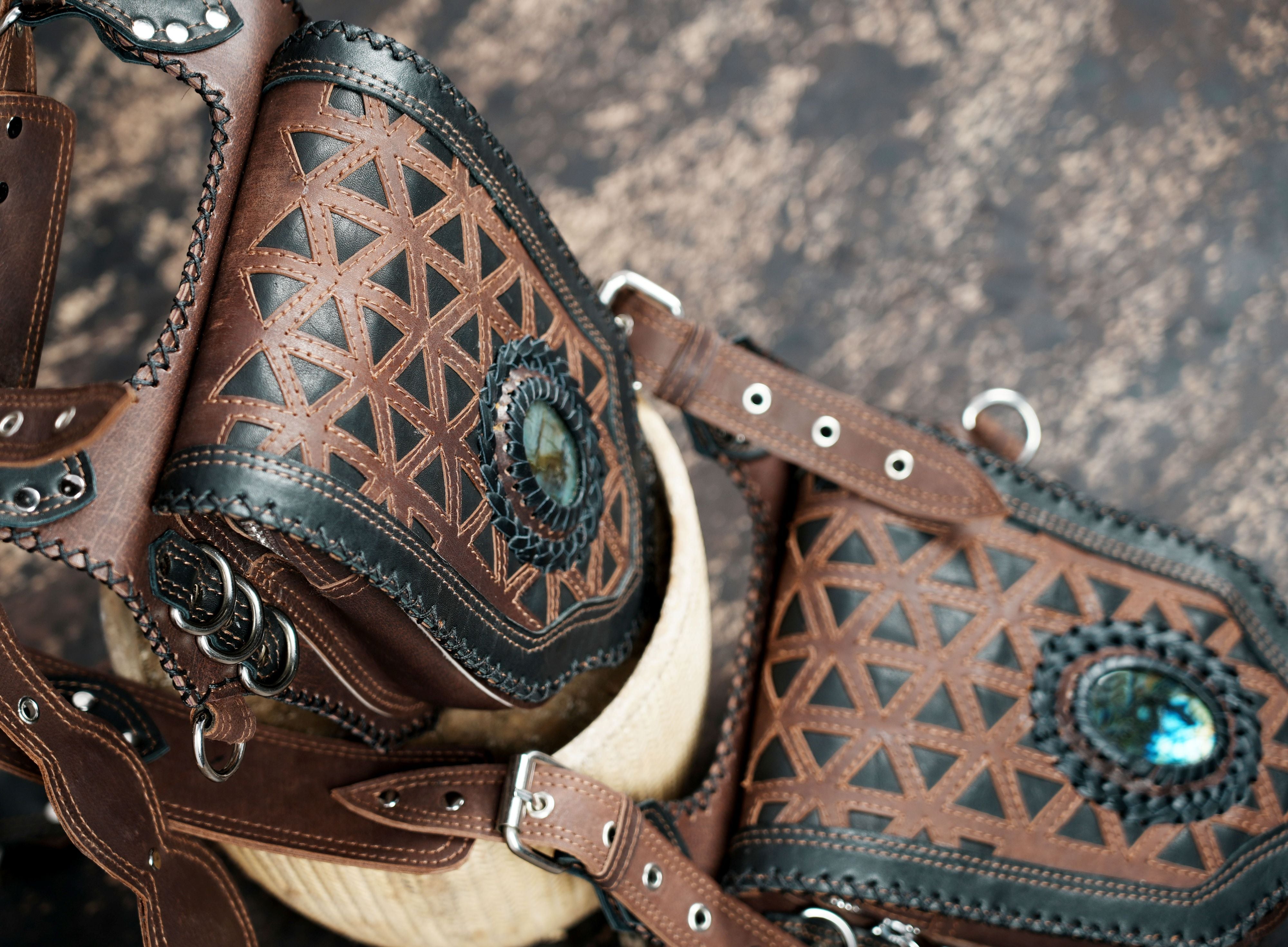 Rustic leather holster harness with braided back support and metal buckles