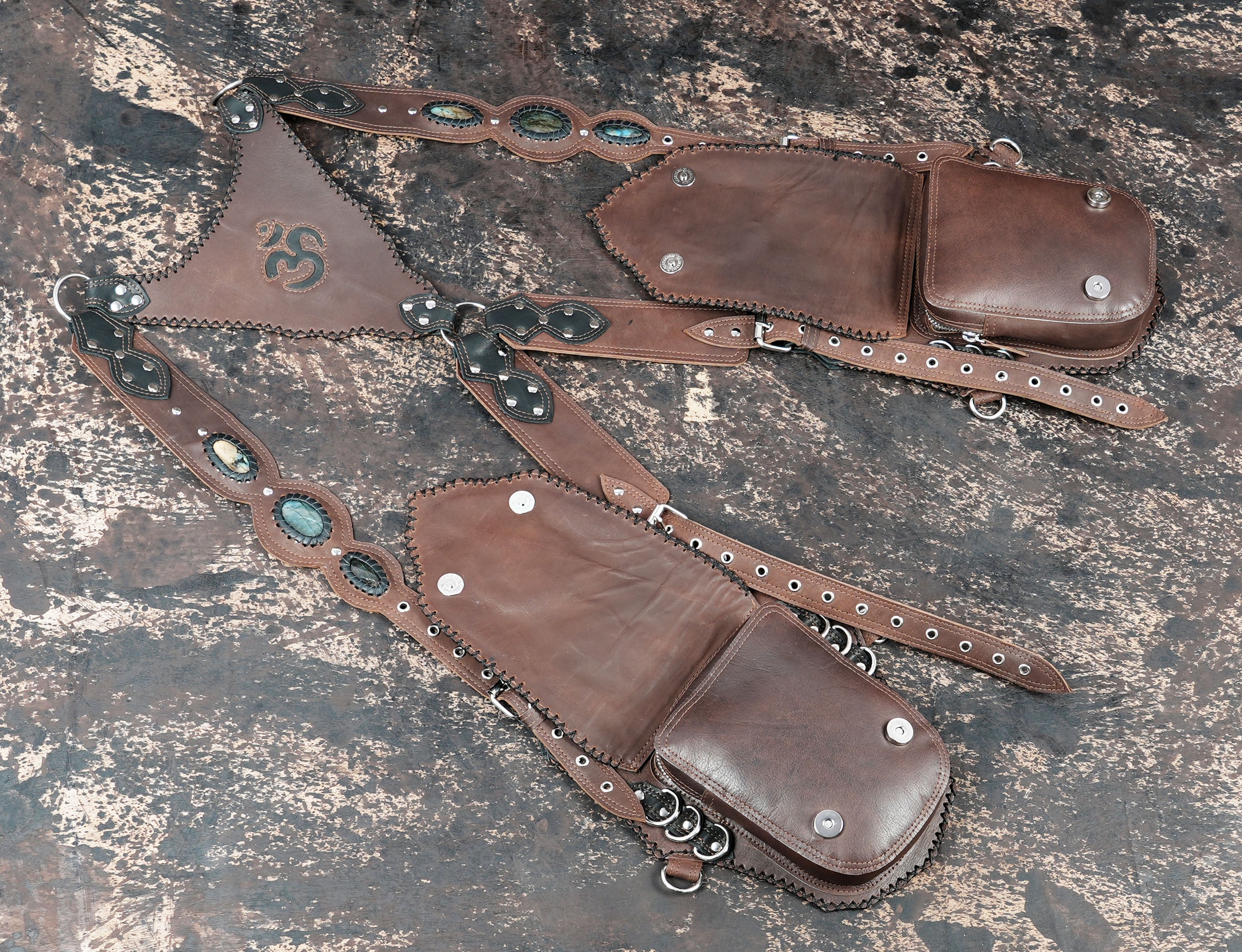 Designer leather holster harness with artistic patterns and stone accents