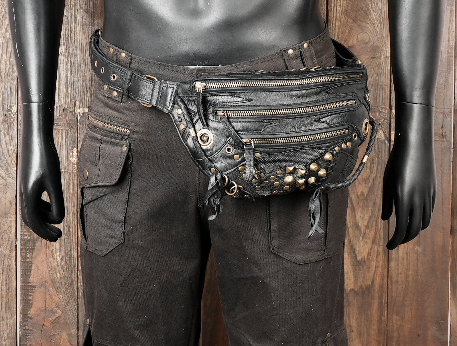 Statement leather shoulder belt with bold studded design