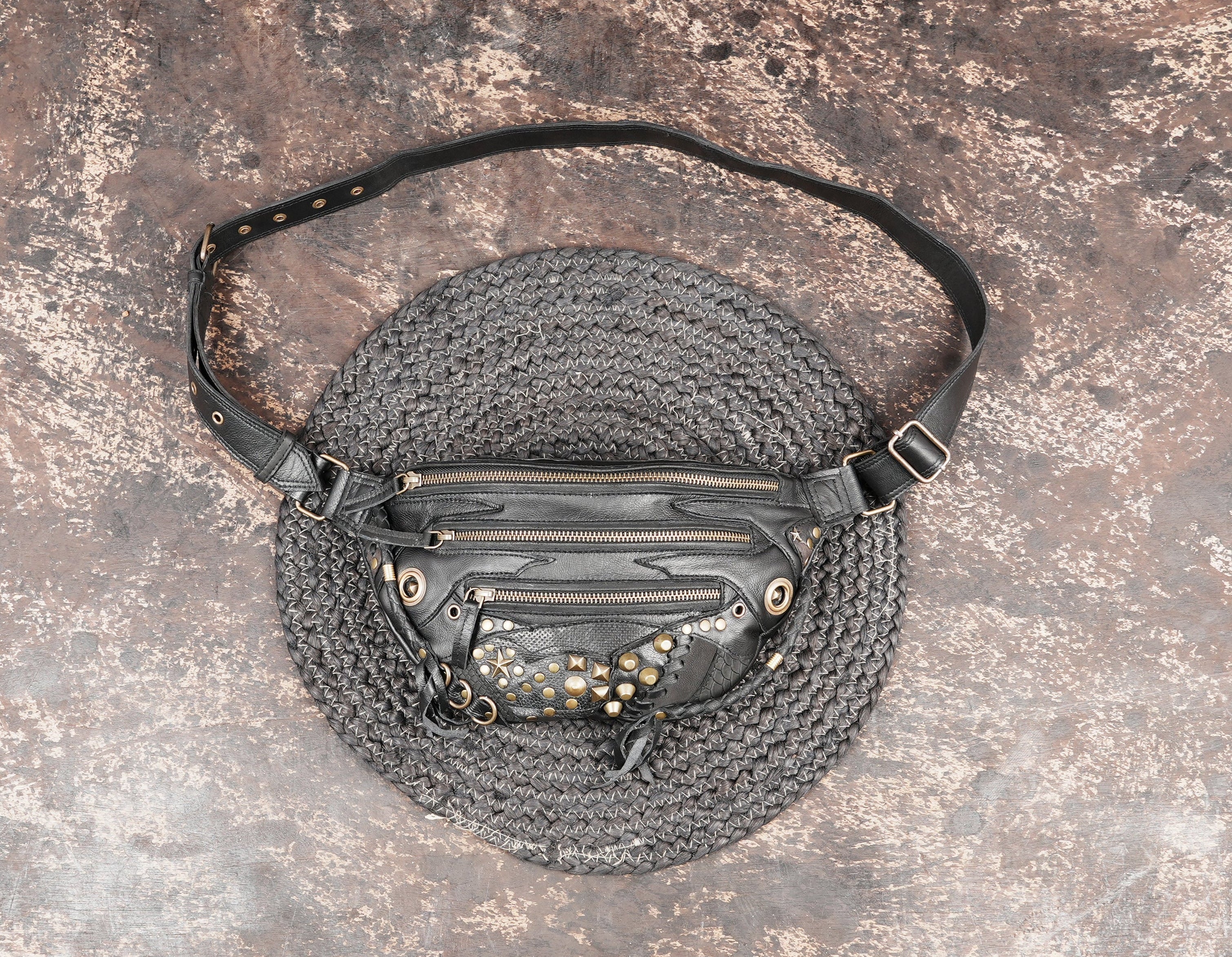 Black leather shoulder belt bag with stud detailing and zip pockets
