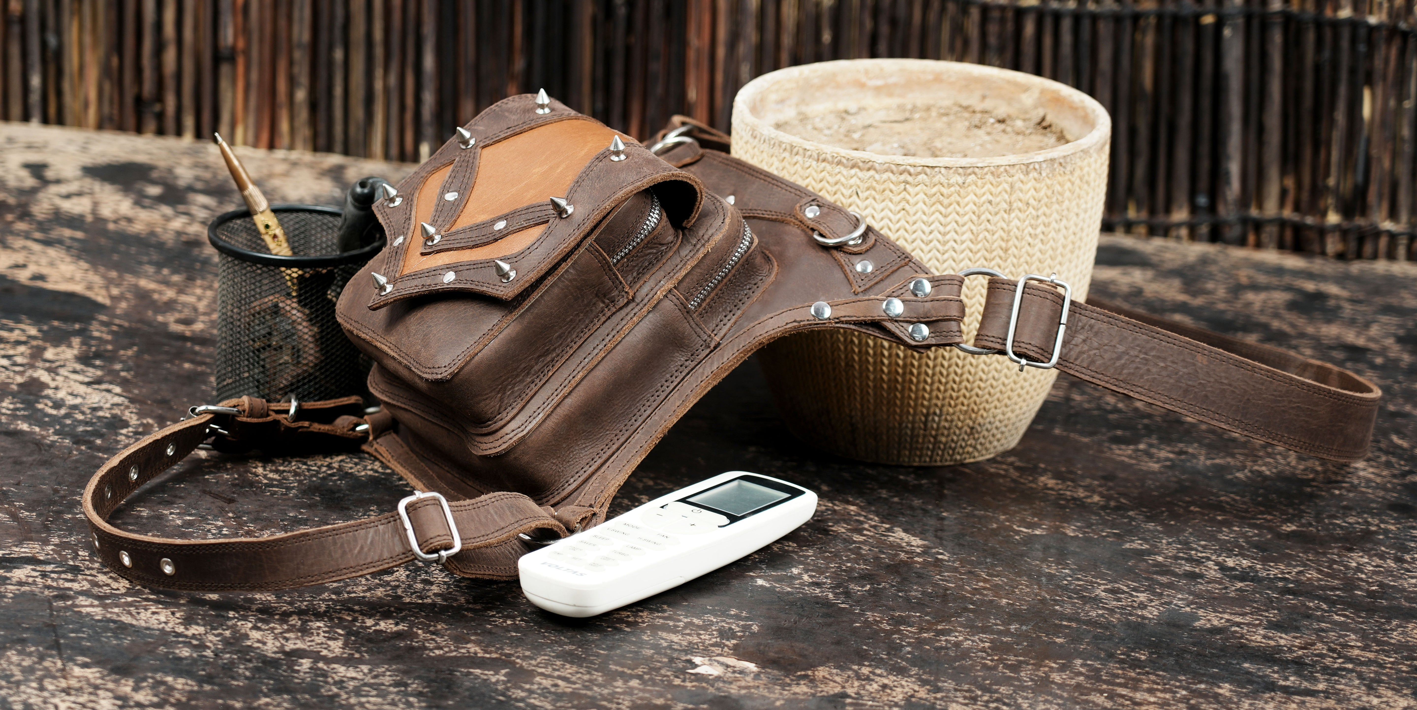 Brown leather utility thigh belt with snap and buckle closures