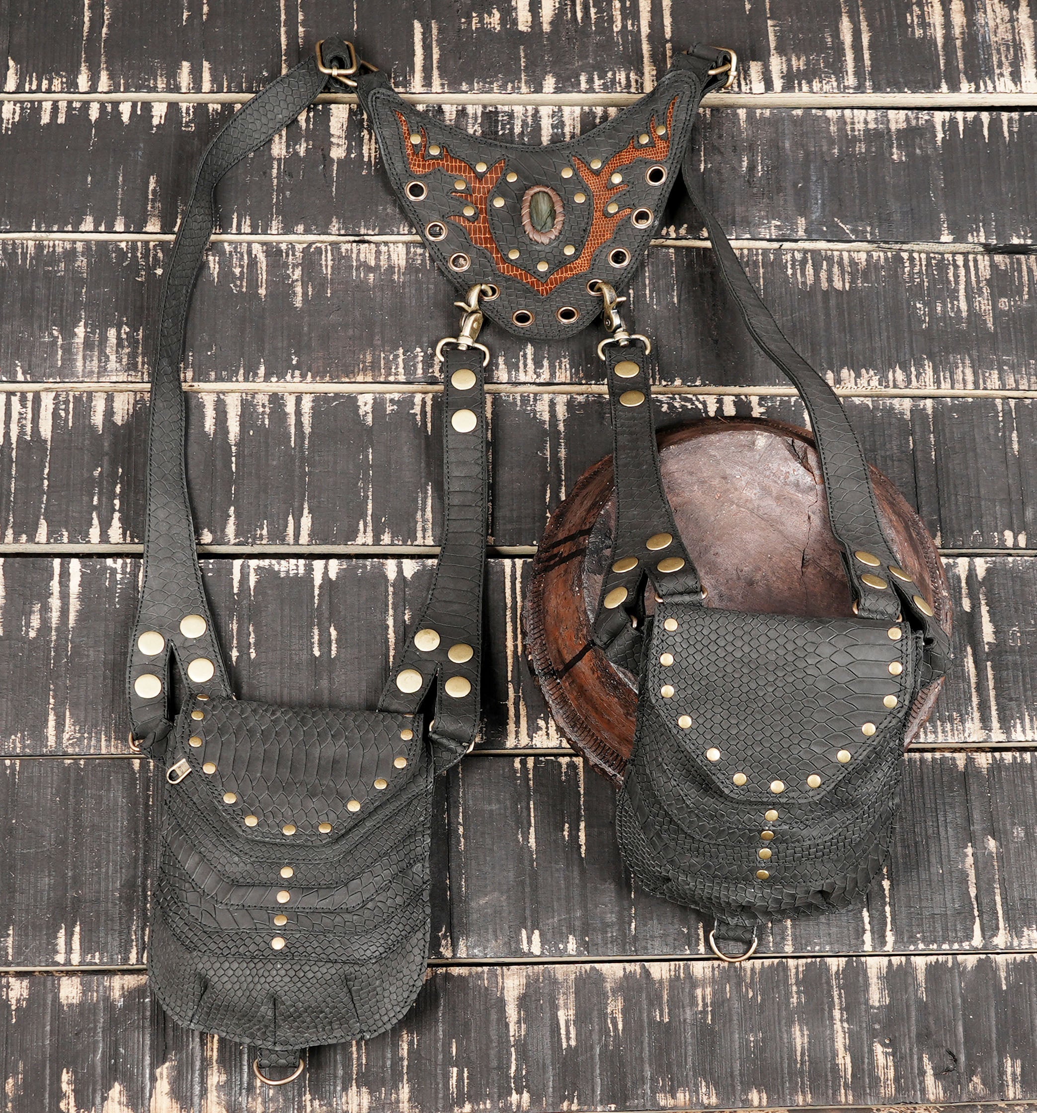 Tribal inspired leather holster with layered pouch design and strong stitching