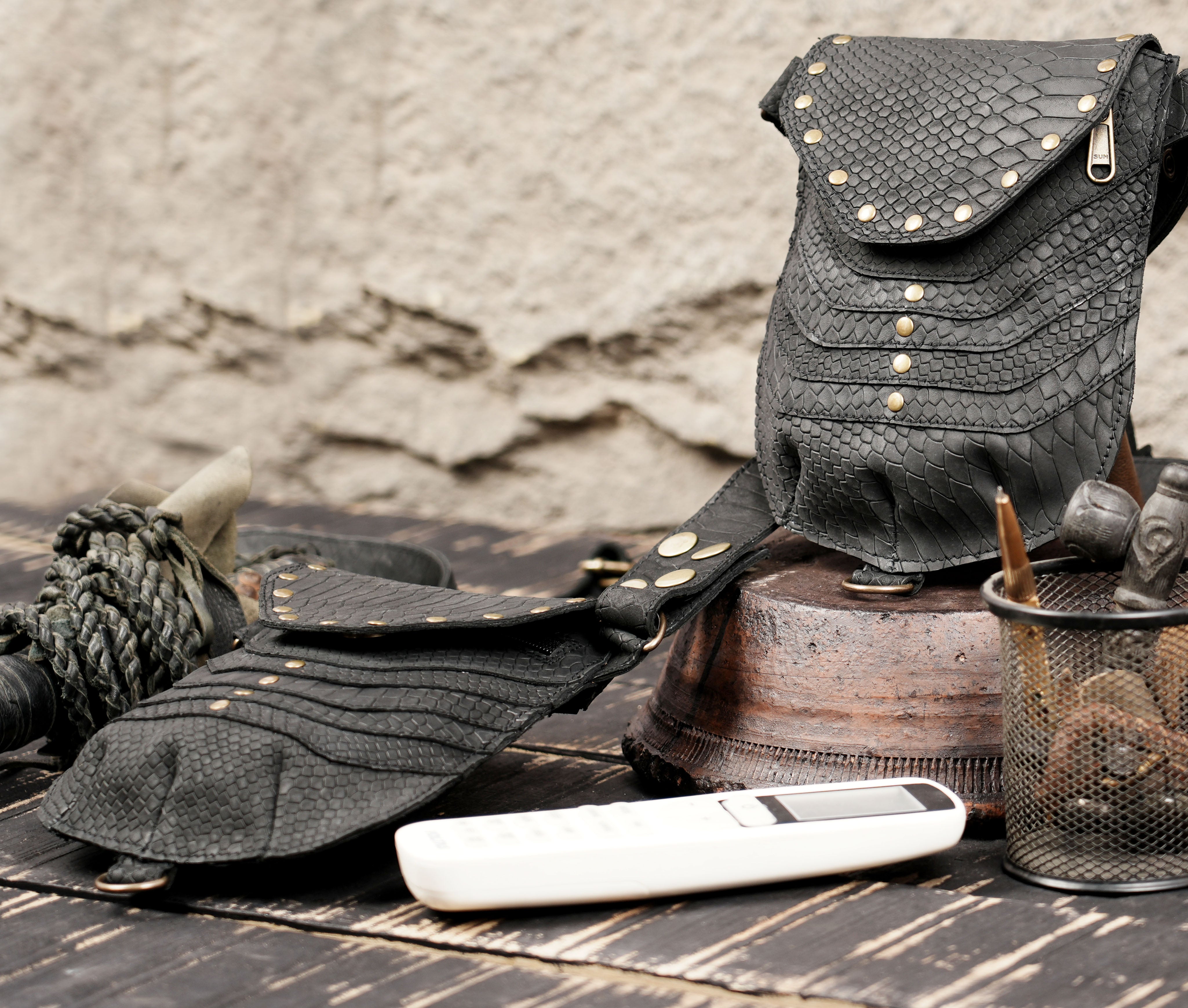 Artisan leather holster pouch set with rugged texture and secure snap closures