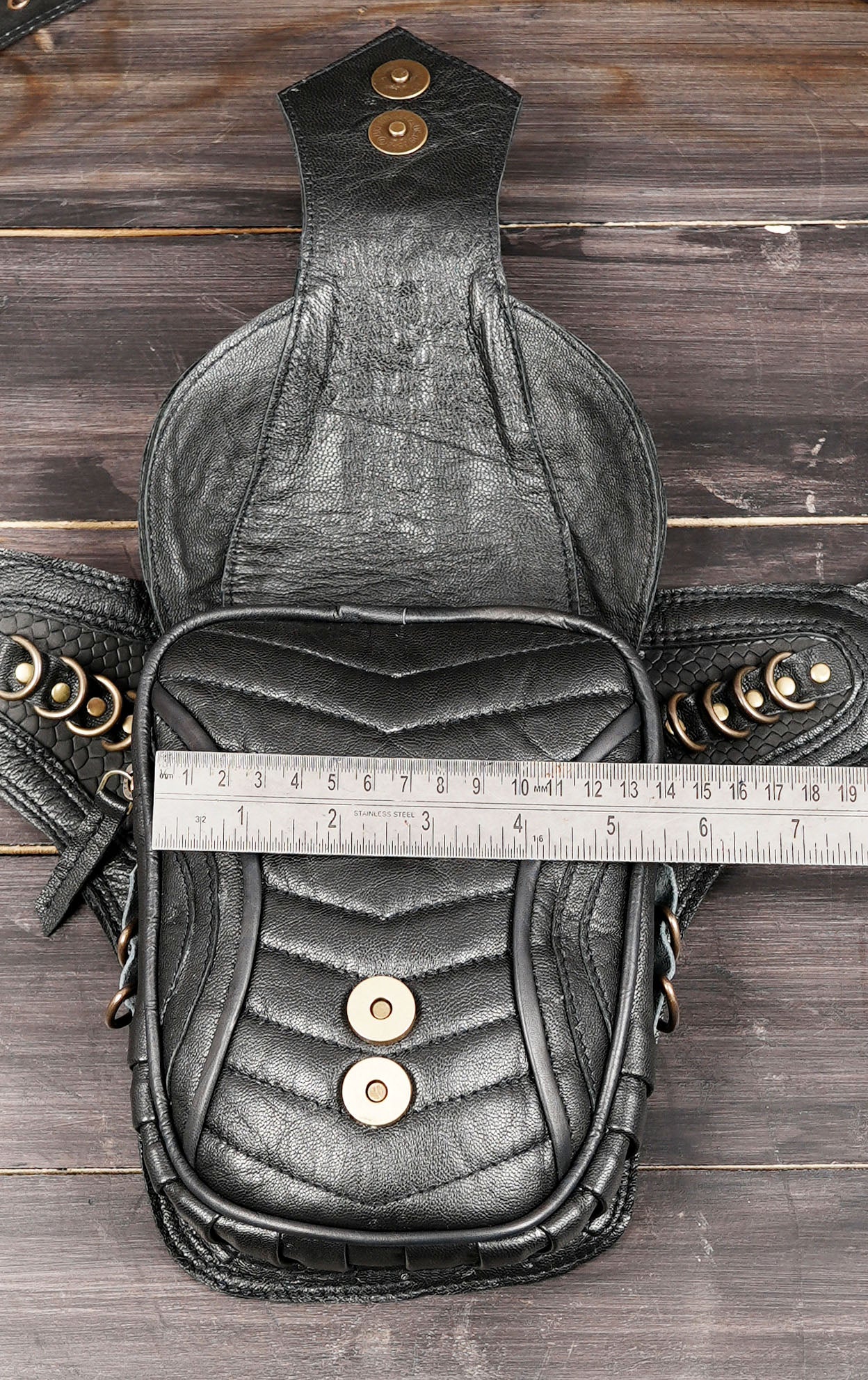 Biker style leather waist belt with decorative rings and rivets