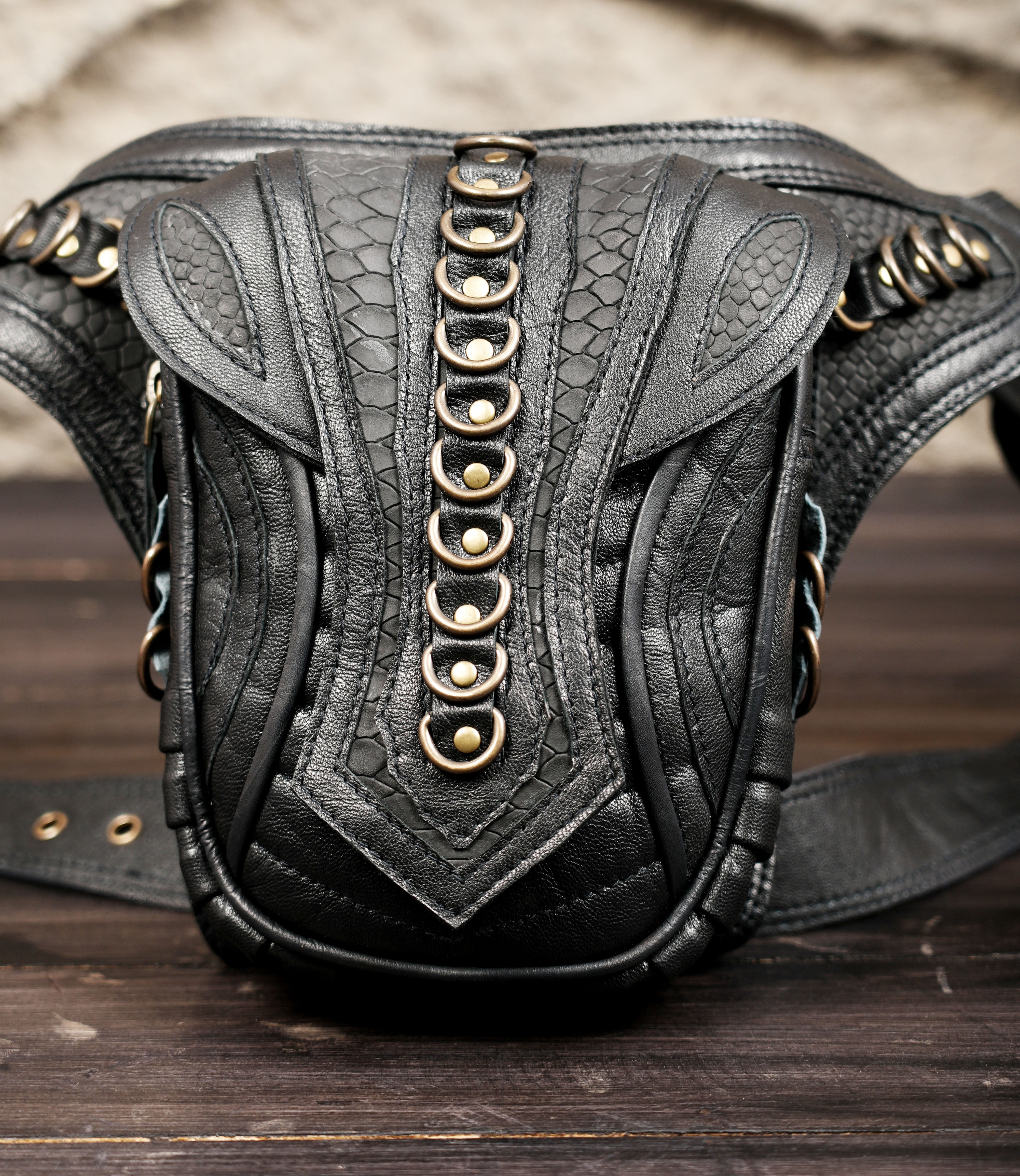 Steampunk style leather waist belt with detailed stitching and hardware