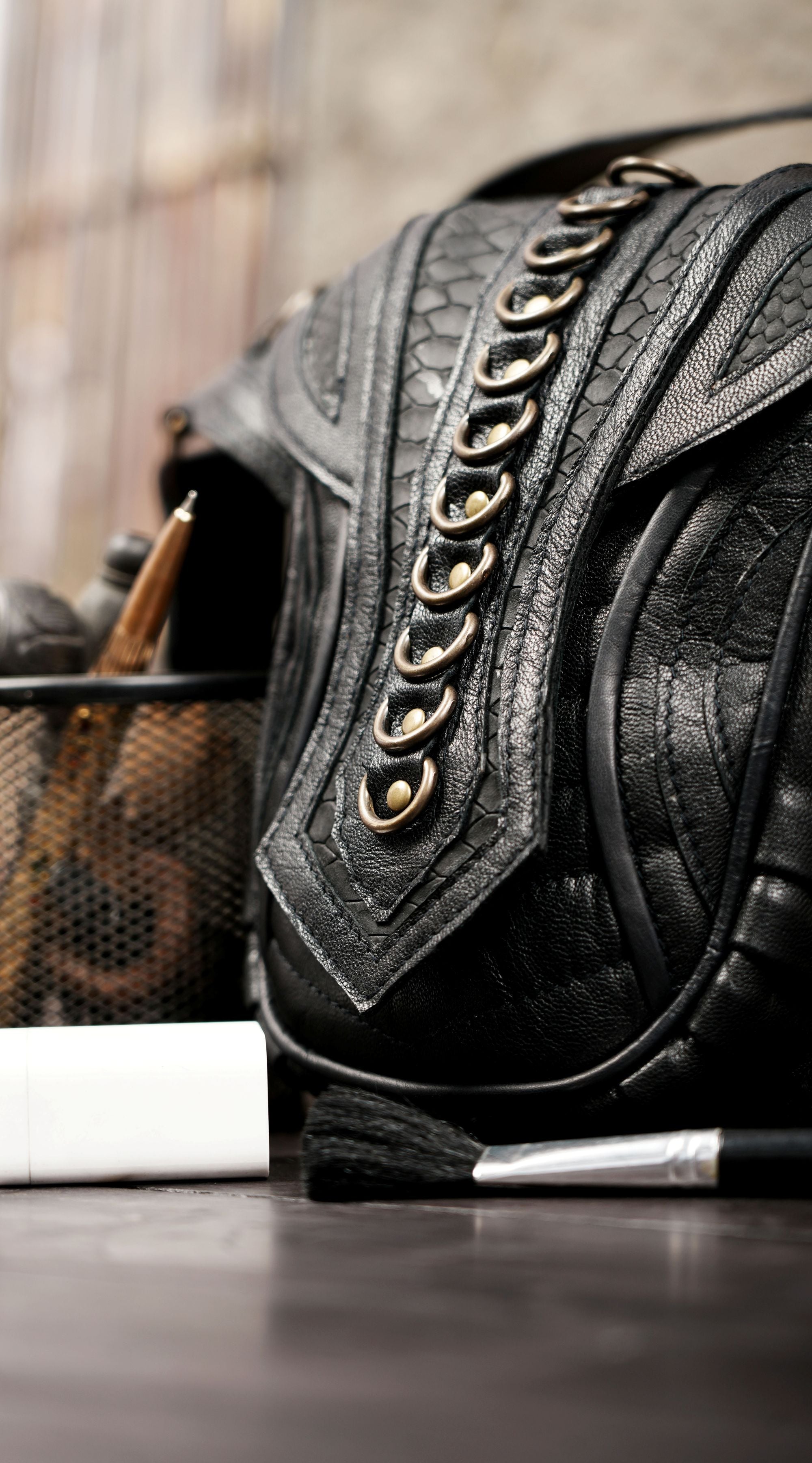 Unisex leather waist belt with secure front pouch and metal detailing