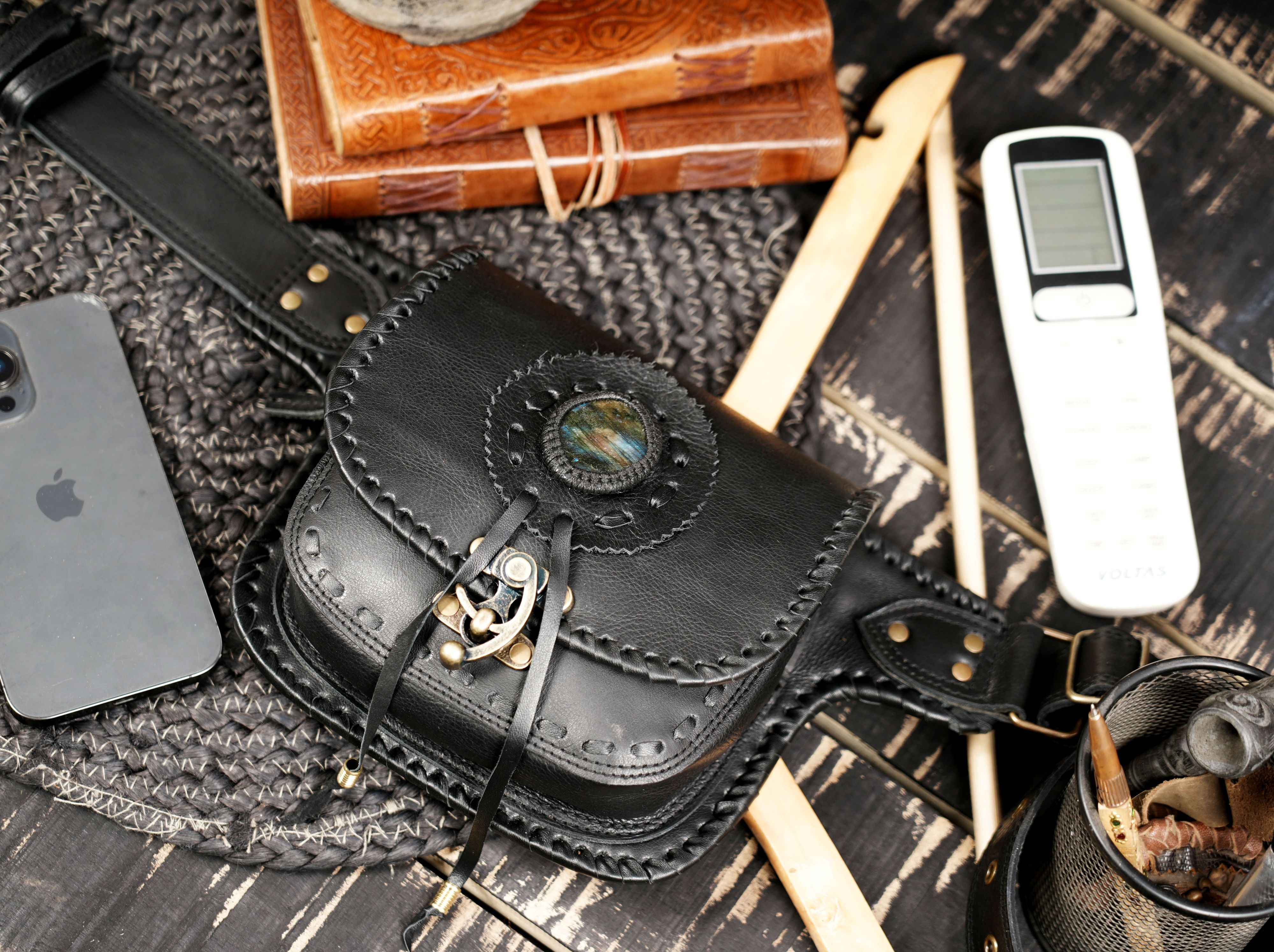 Artisan made leather belt bag with gemstone accent and snap button closure