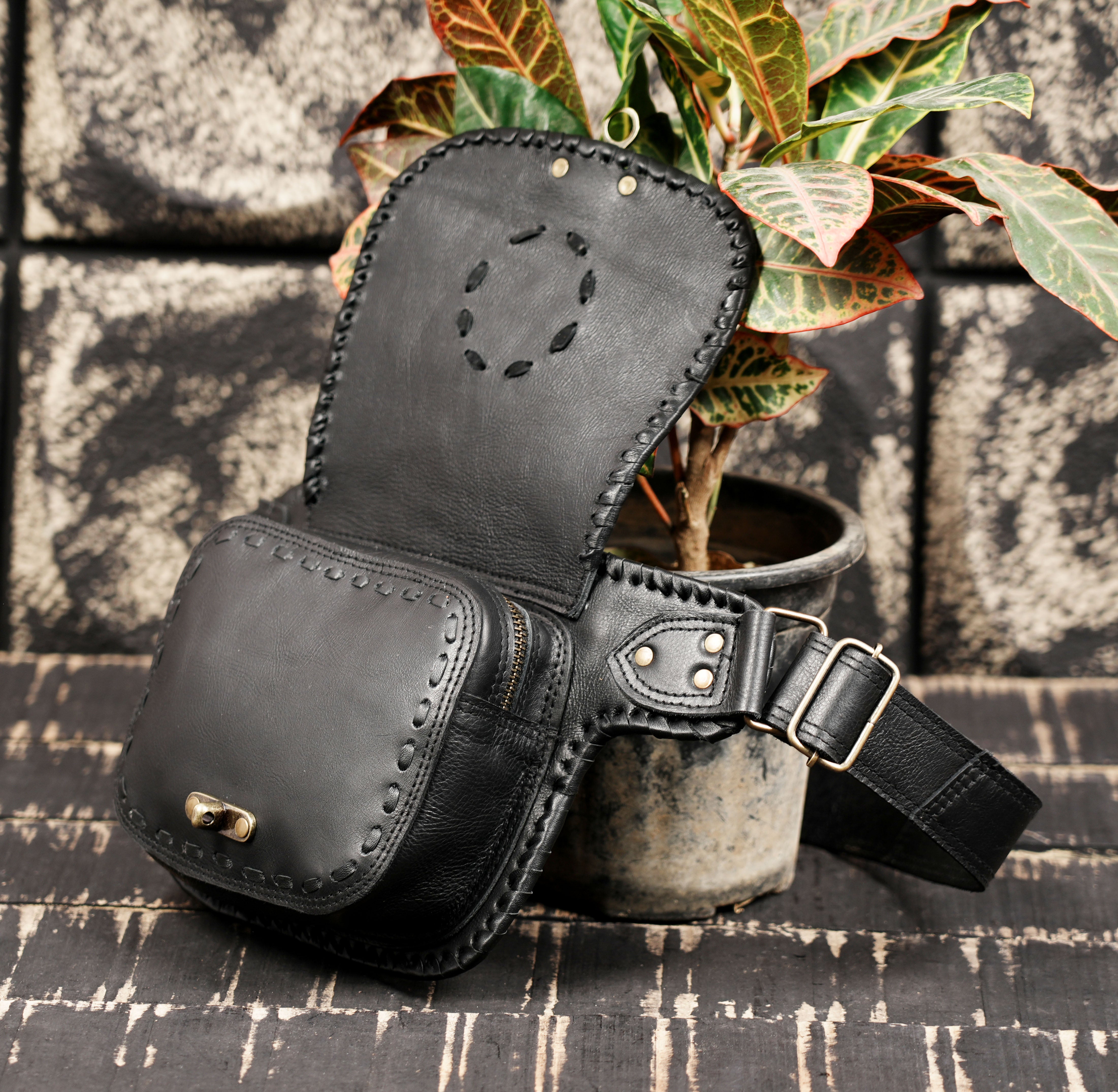 Leather waist belt with functional pouch and adjustable strap design