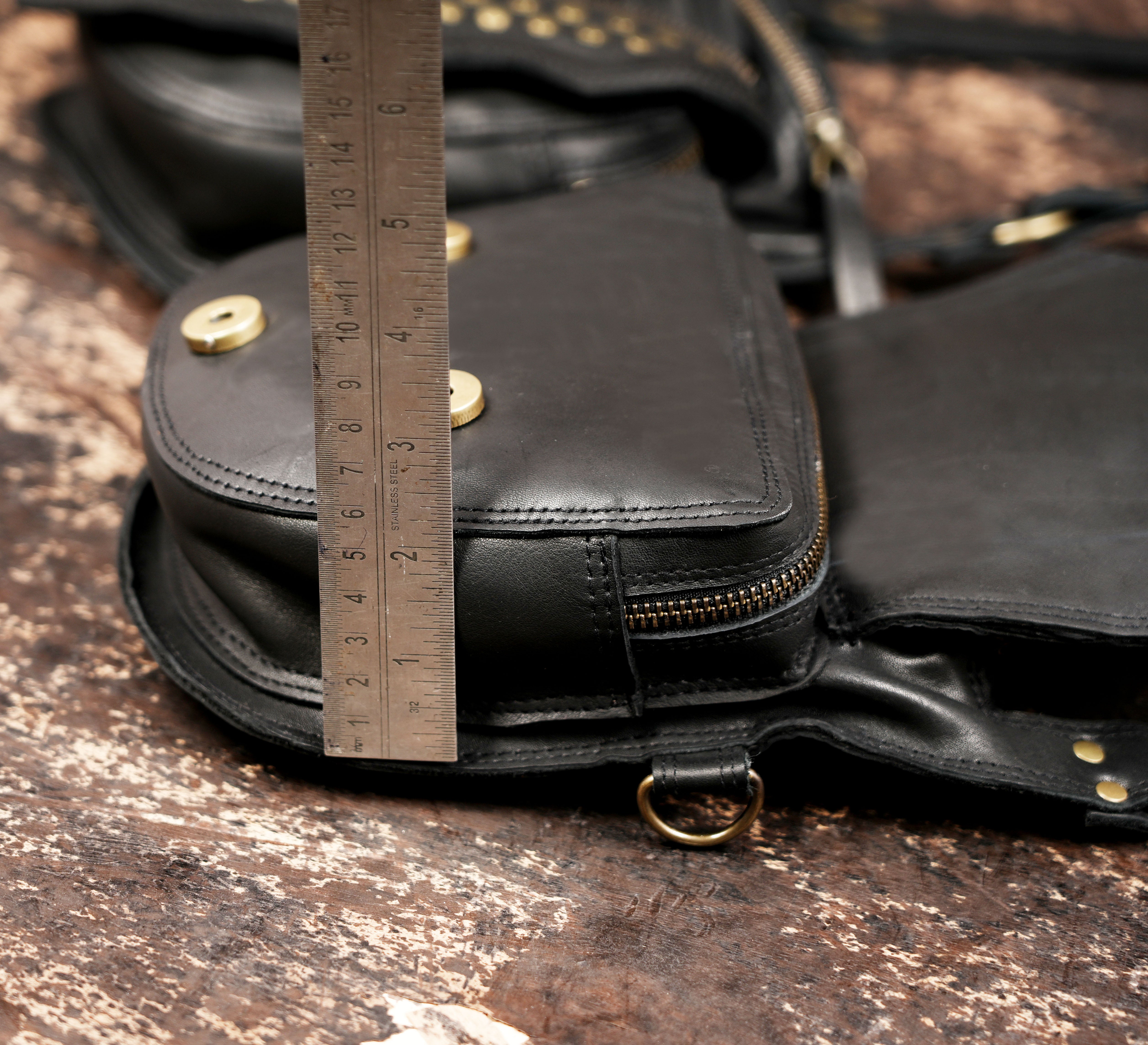 Gothic leather holster pouch with brass rivets and handcrafted stitching