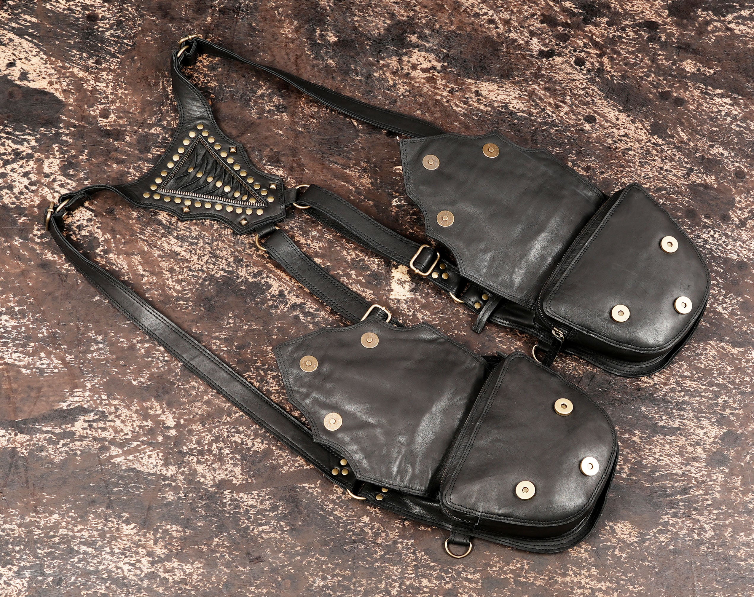Festival ready leather holster with twin pouches and bold studded pattern