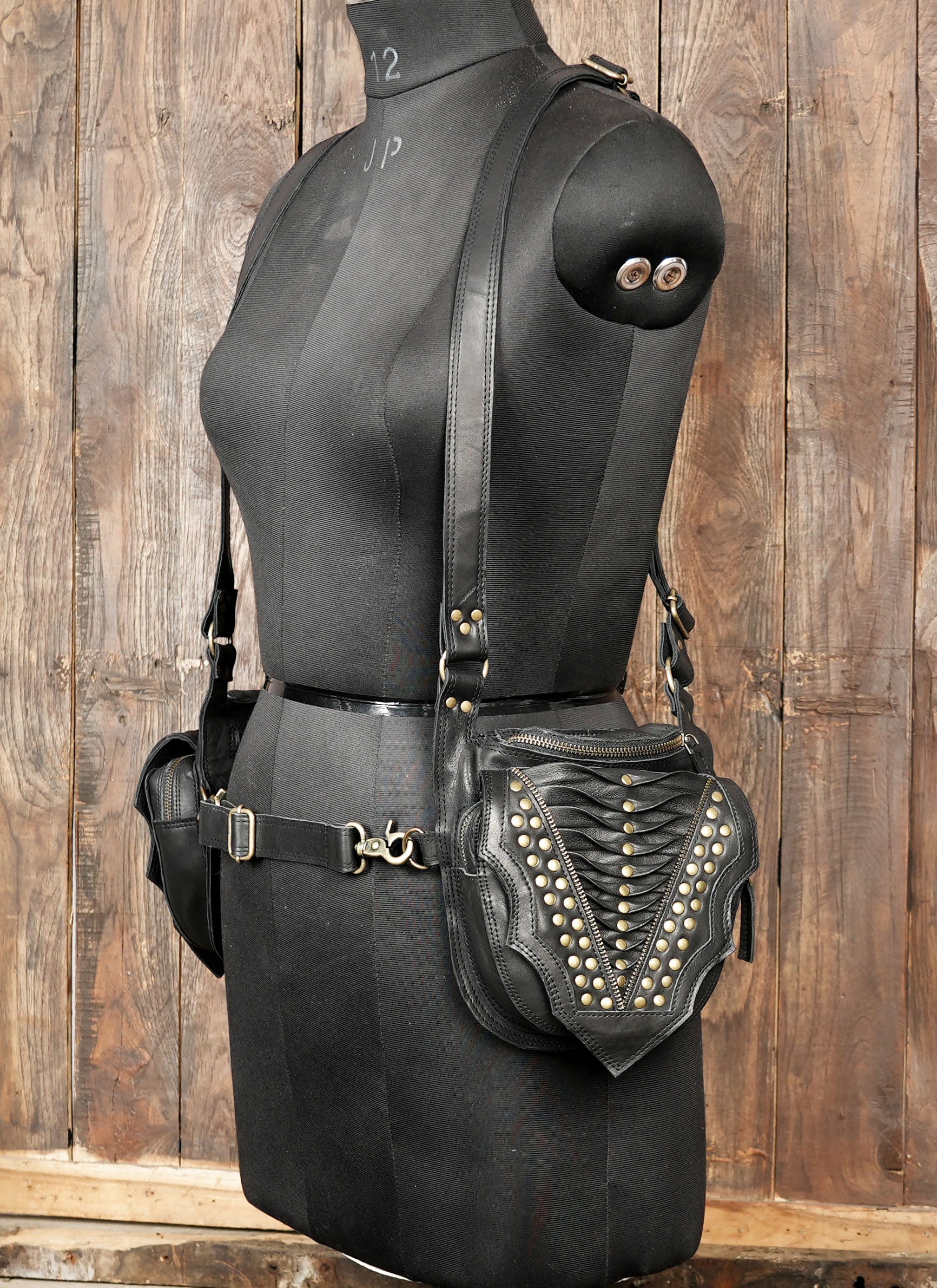 Handmade black leather holster with brass hardware and secure zip pockets