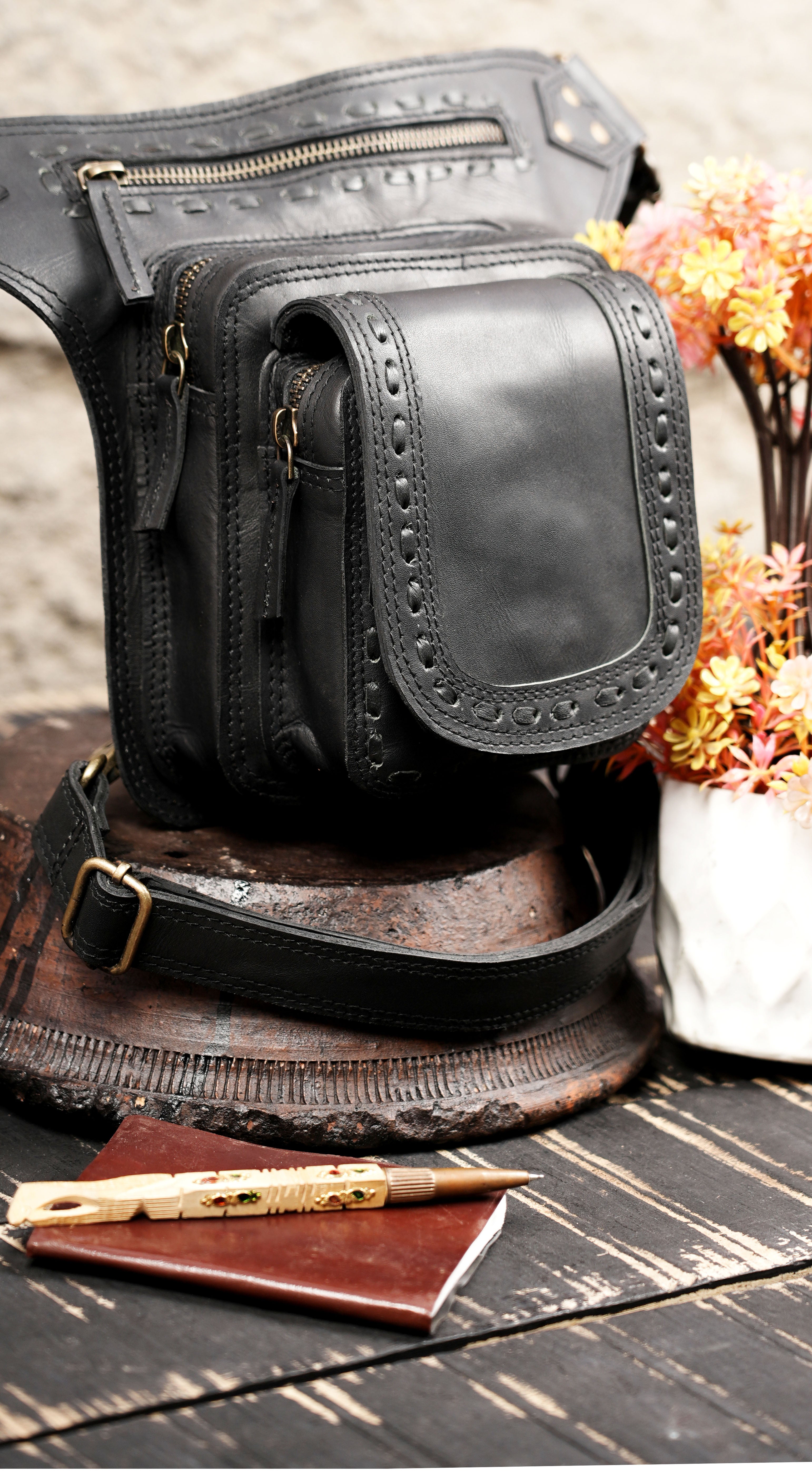 Minimal black leather thigh belt with functional front pocket