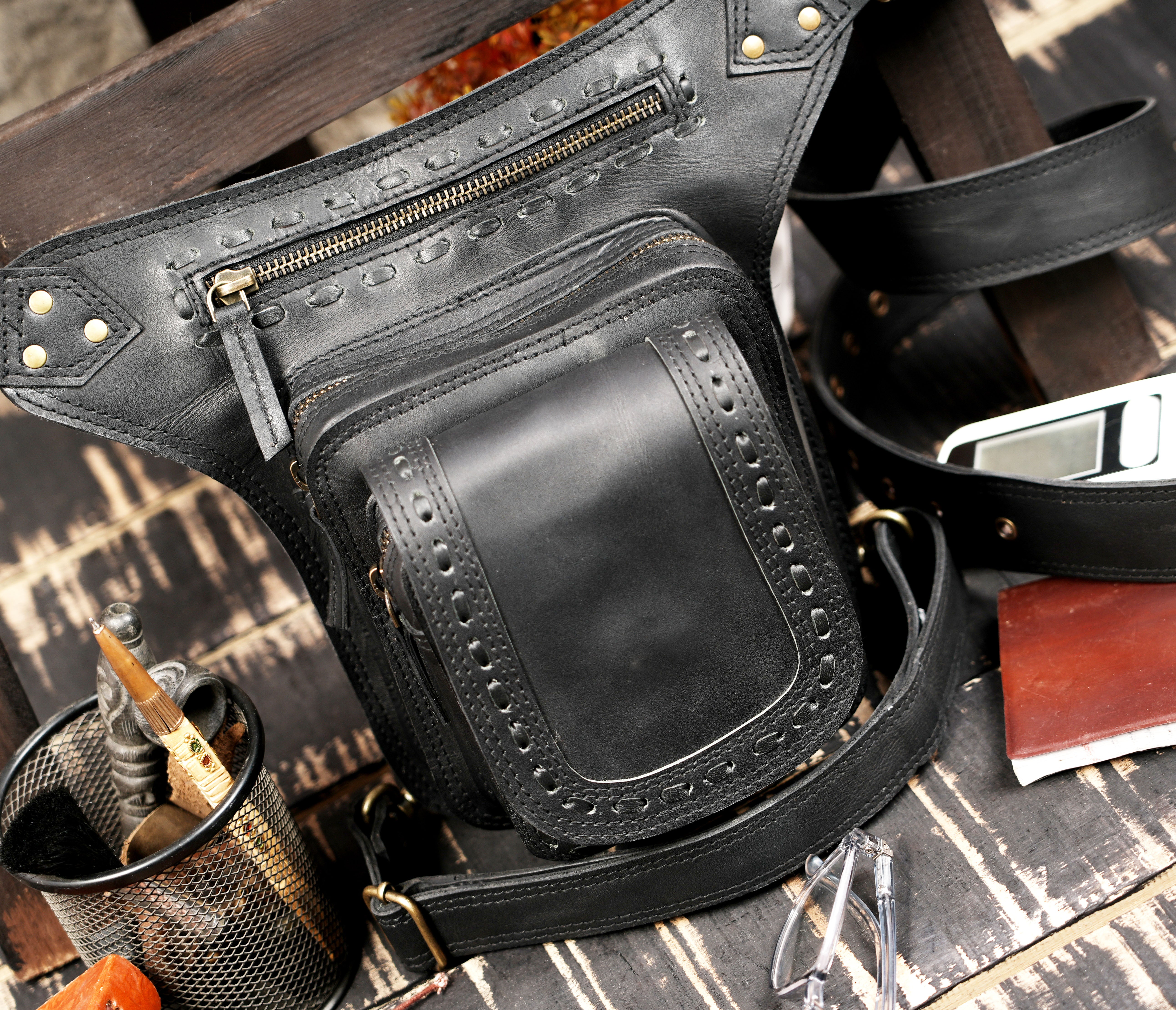 Leather thigh holster belt with secure zip closure and clean design