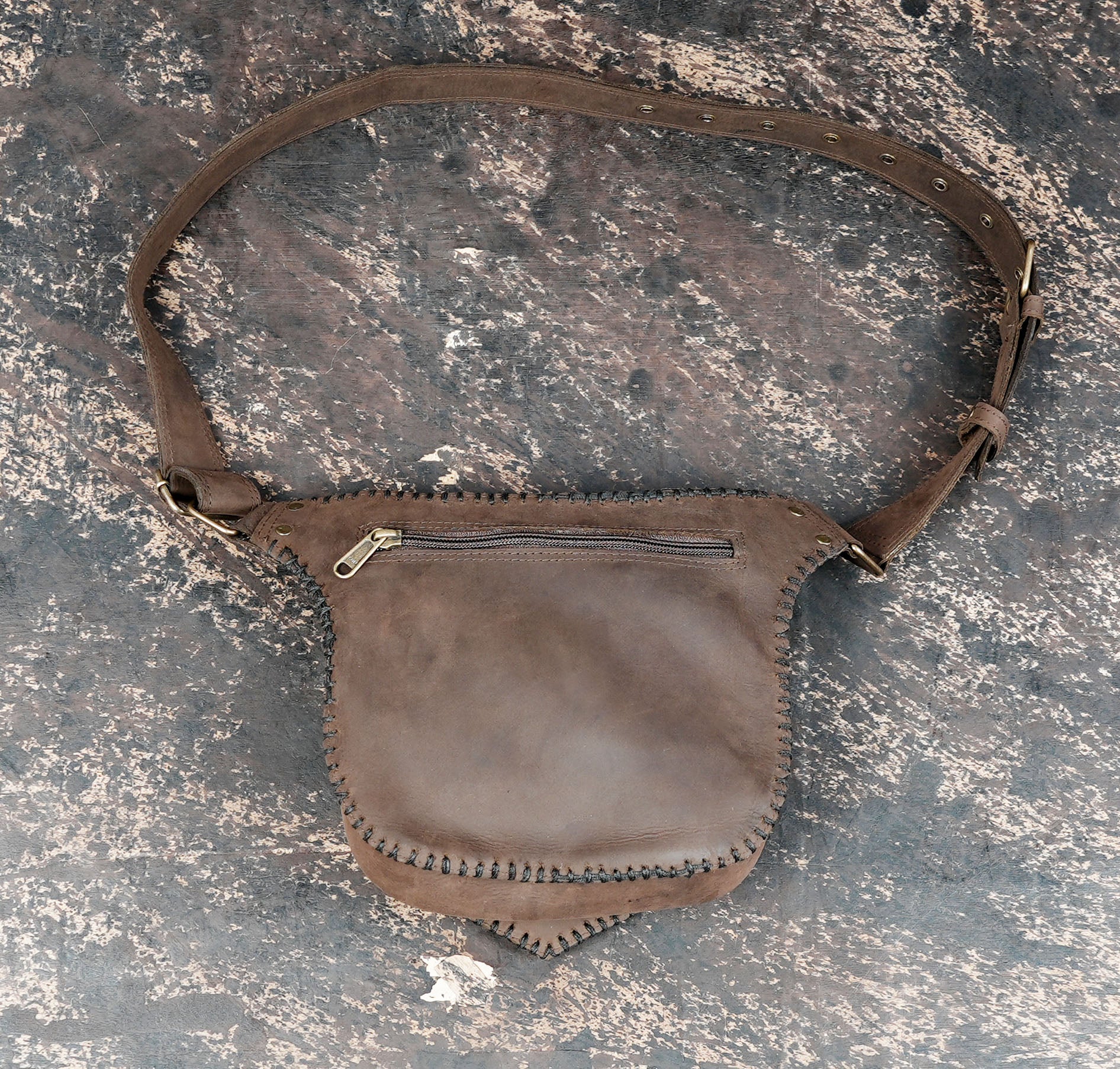 Handcrafted leather utility belt with stone centerpiece