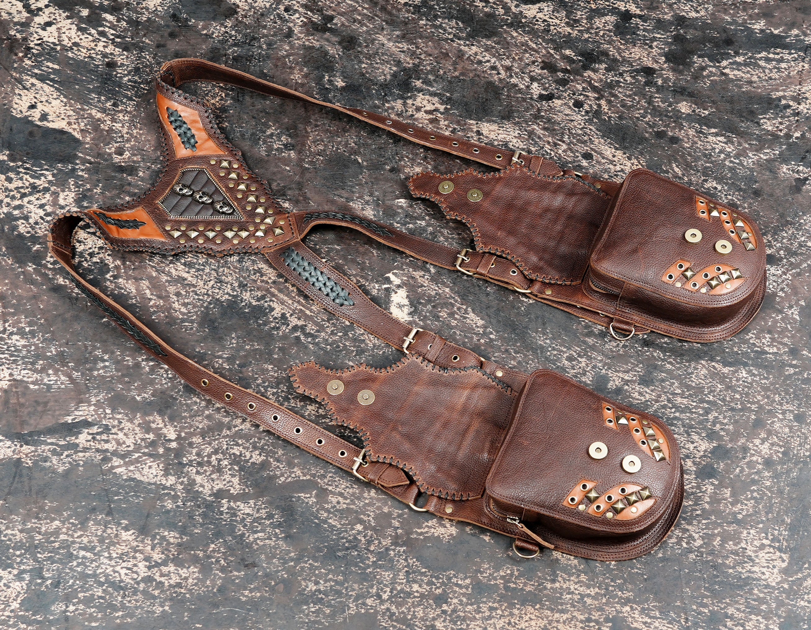 Decorative leather shoulder holster with studs braiding and skulls