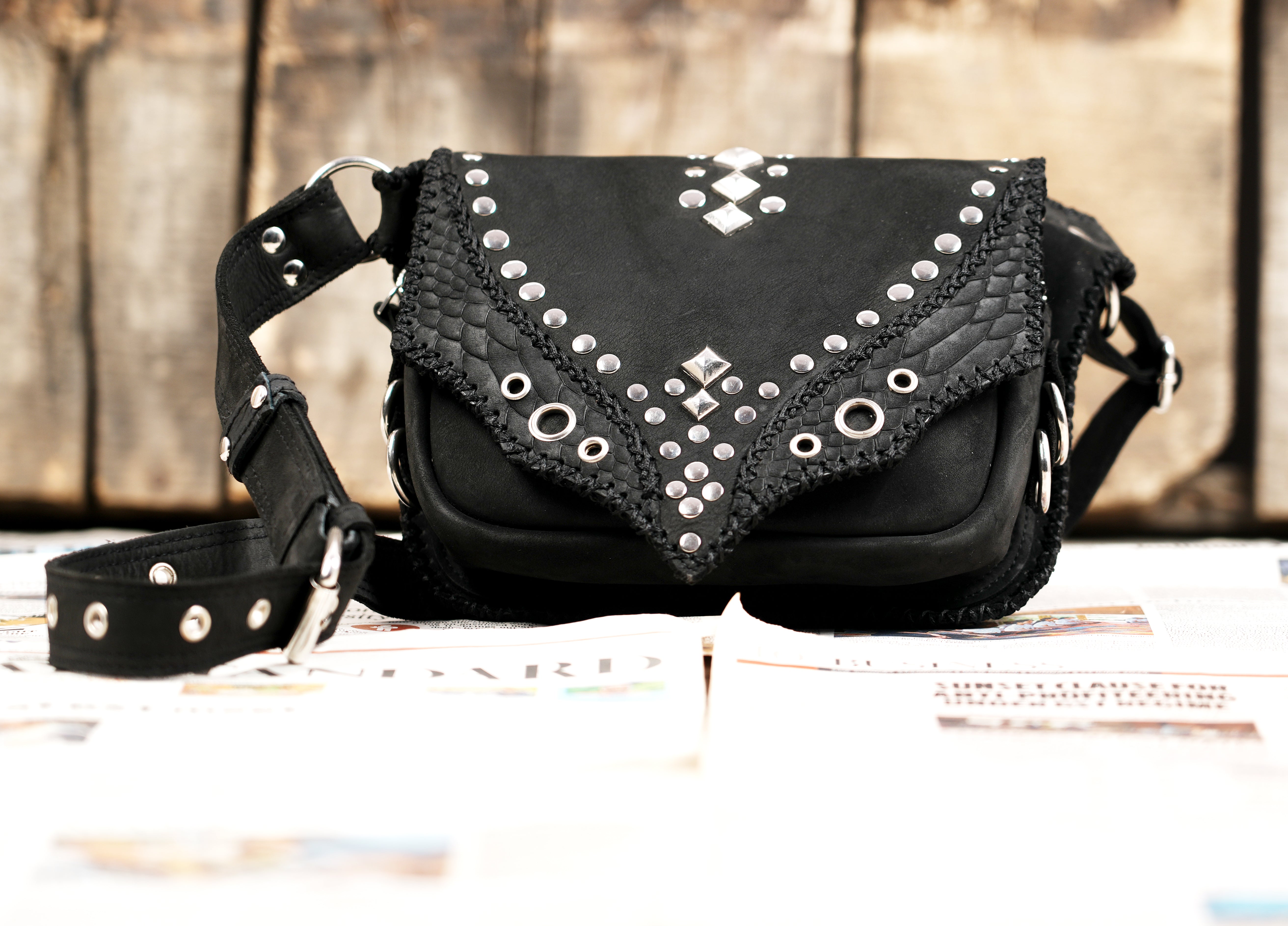 "Unique studded leather waist pouch for festivals and events"