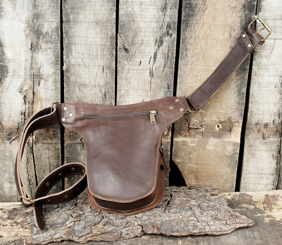 Rustic brown leather utility belt with braided edge accents