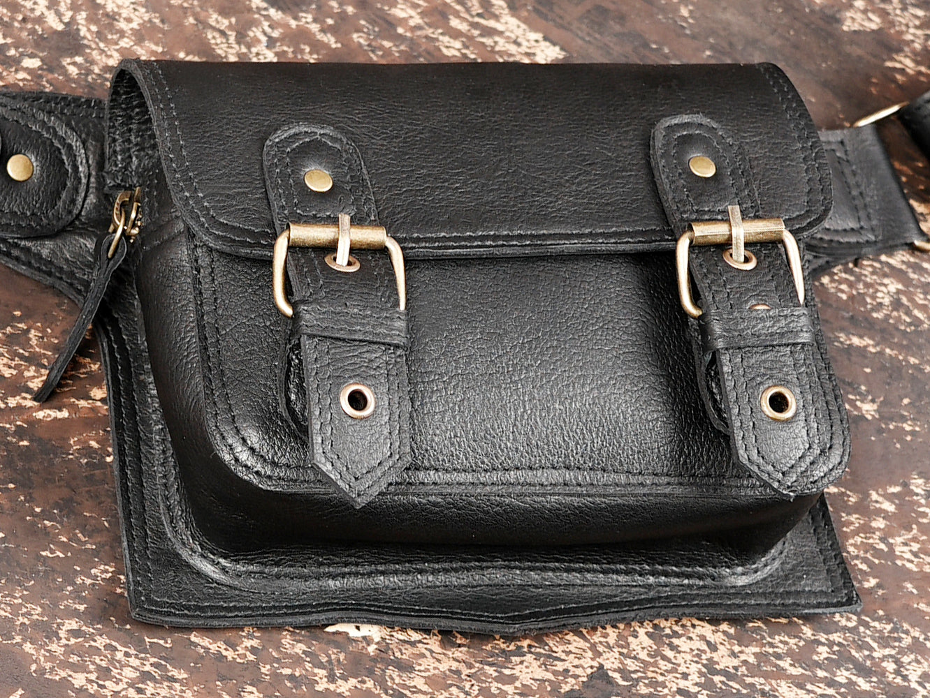 "Leather utility belt pouch with twin buckle closures"