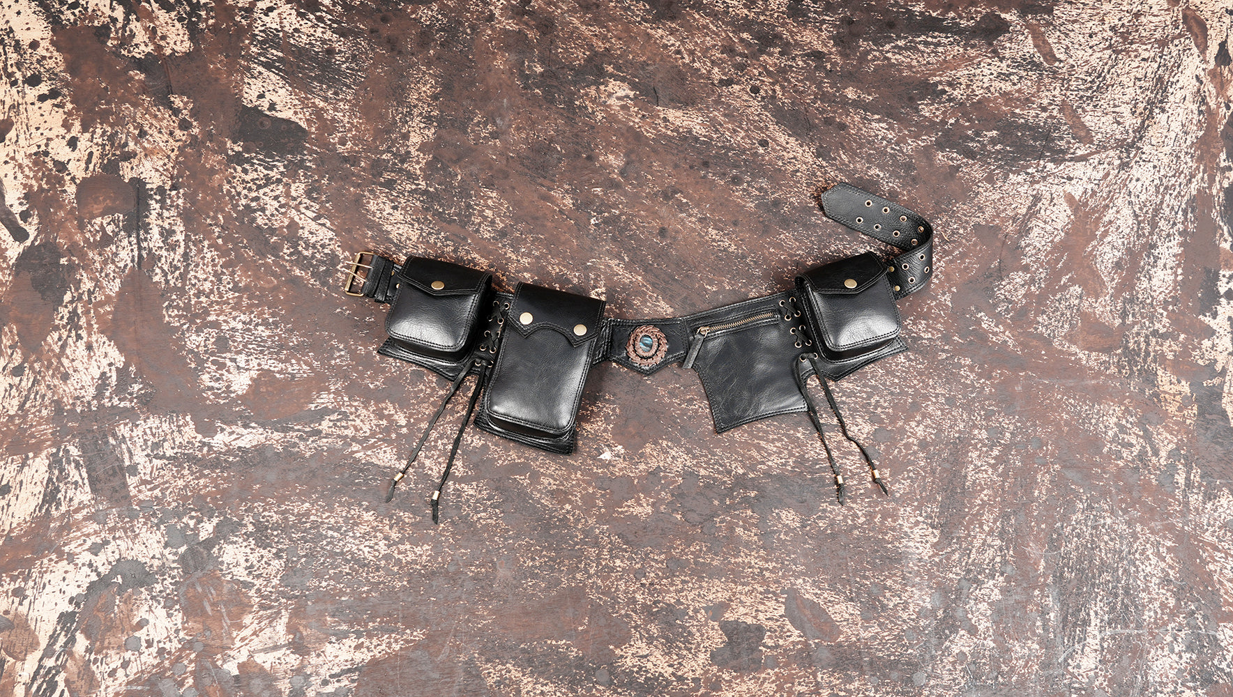 Black leather multi pocket waist belt with gemstone centerpiece