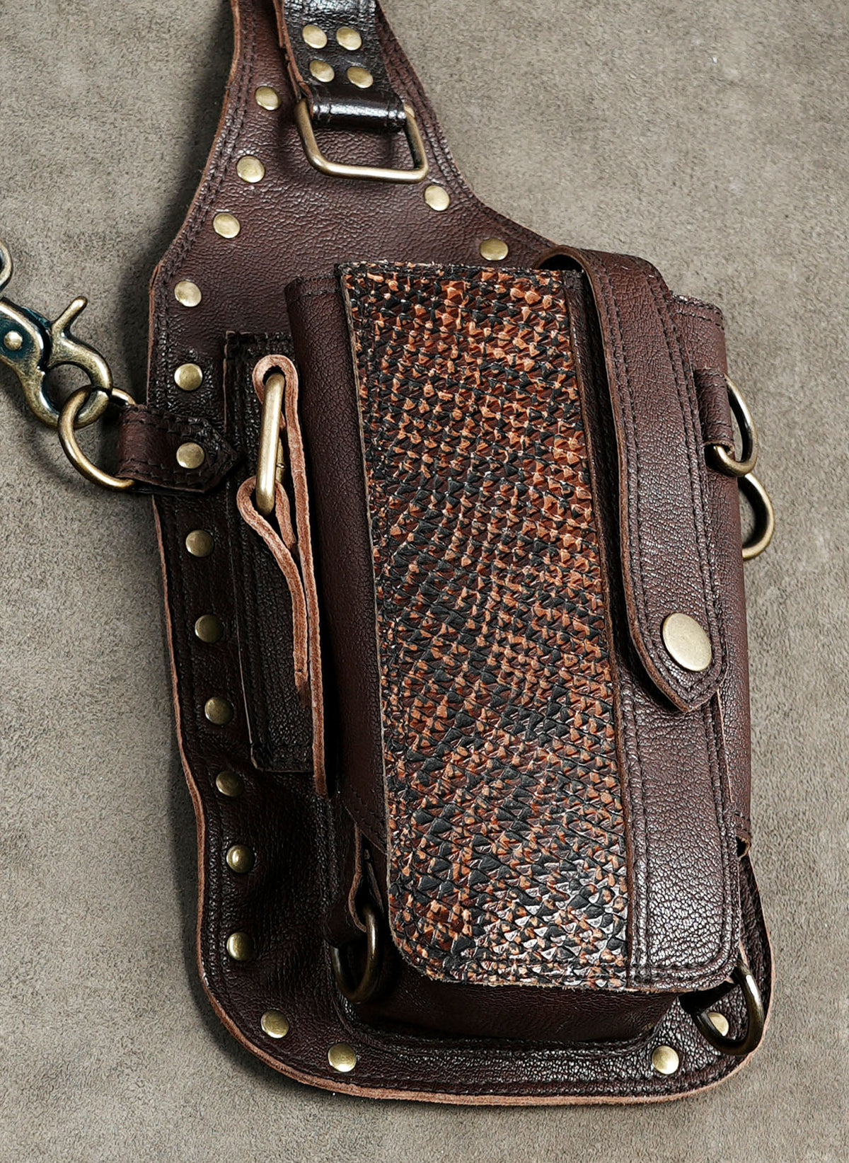 Brown leather shoulder holster purse with front flap closures and decorative gemstone accents.